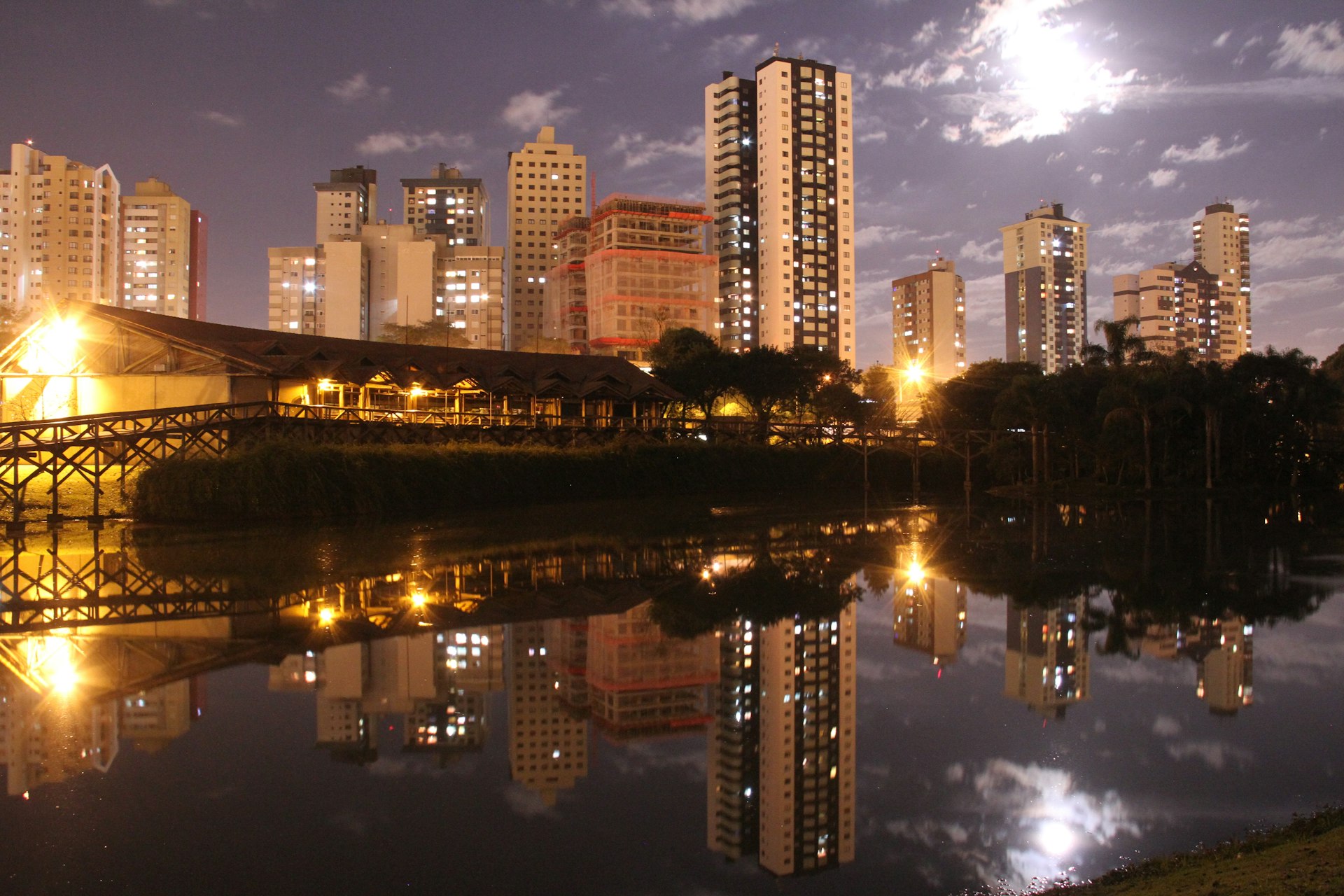 A view of the skyline at night across the lake of the botanic garden, Curitiba, Paraná, Brazil