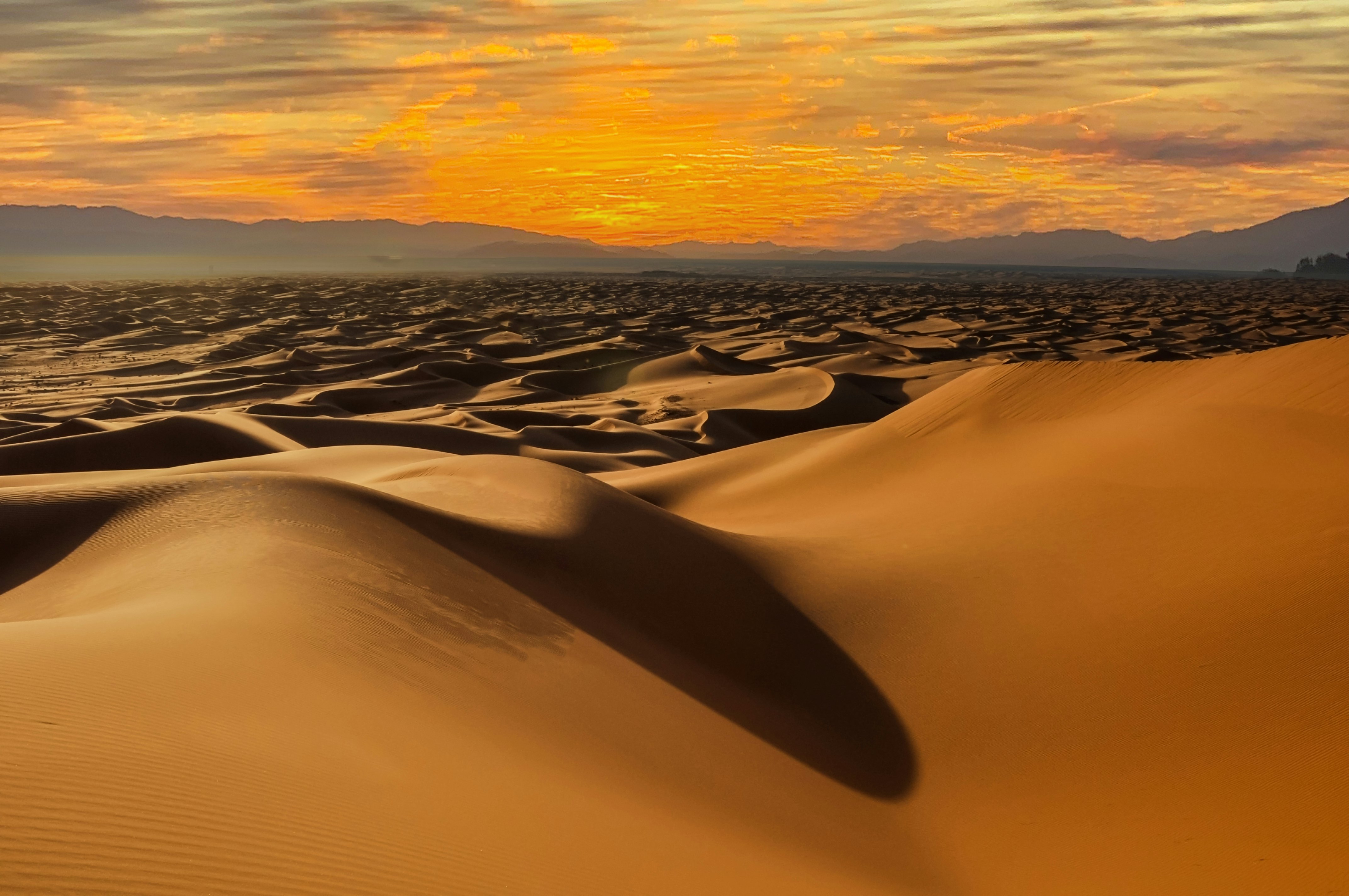 Dusk clouds over the sand dunes near the Timimoun Algeria.