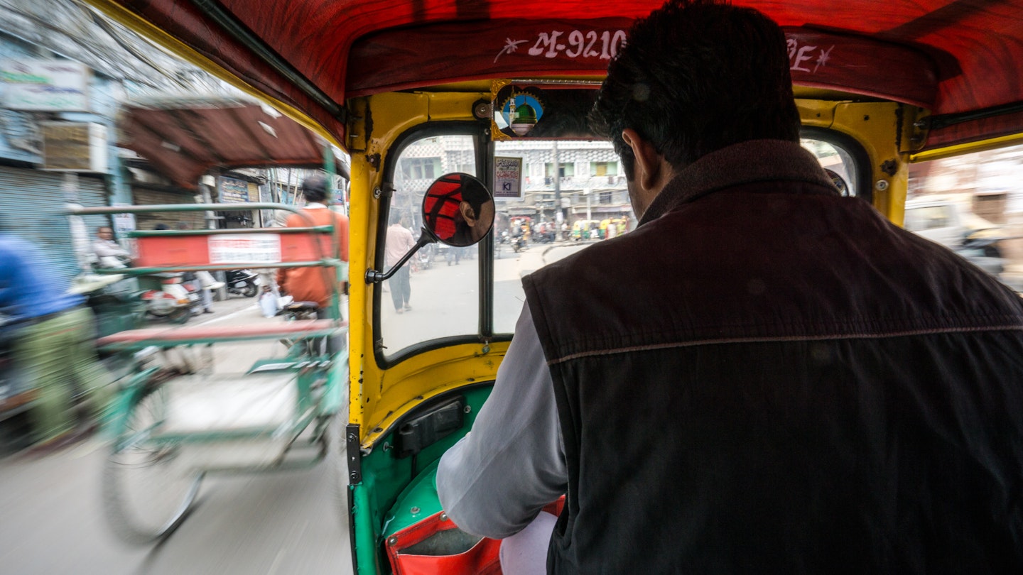 A shot of an interior view from an auto rickshaw, also known as a three-wheeler, samosa, tempo, tuk-tuk, trishaw, autorick, or bajaj, at Old Delhi, India in slow motion.
578680275
© runner of art / Getty Images