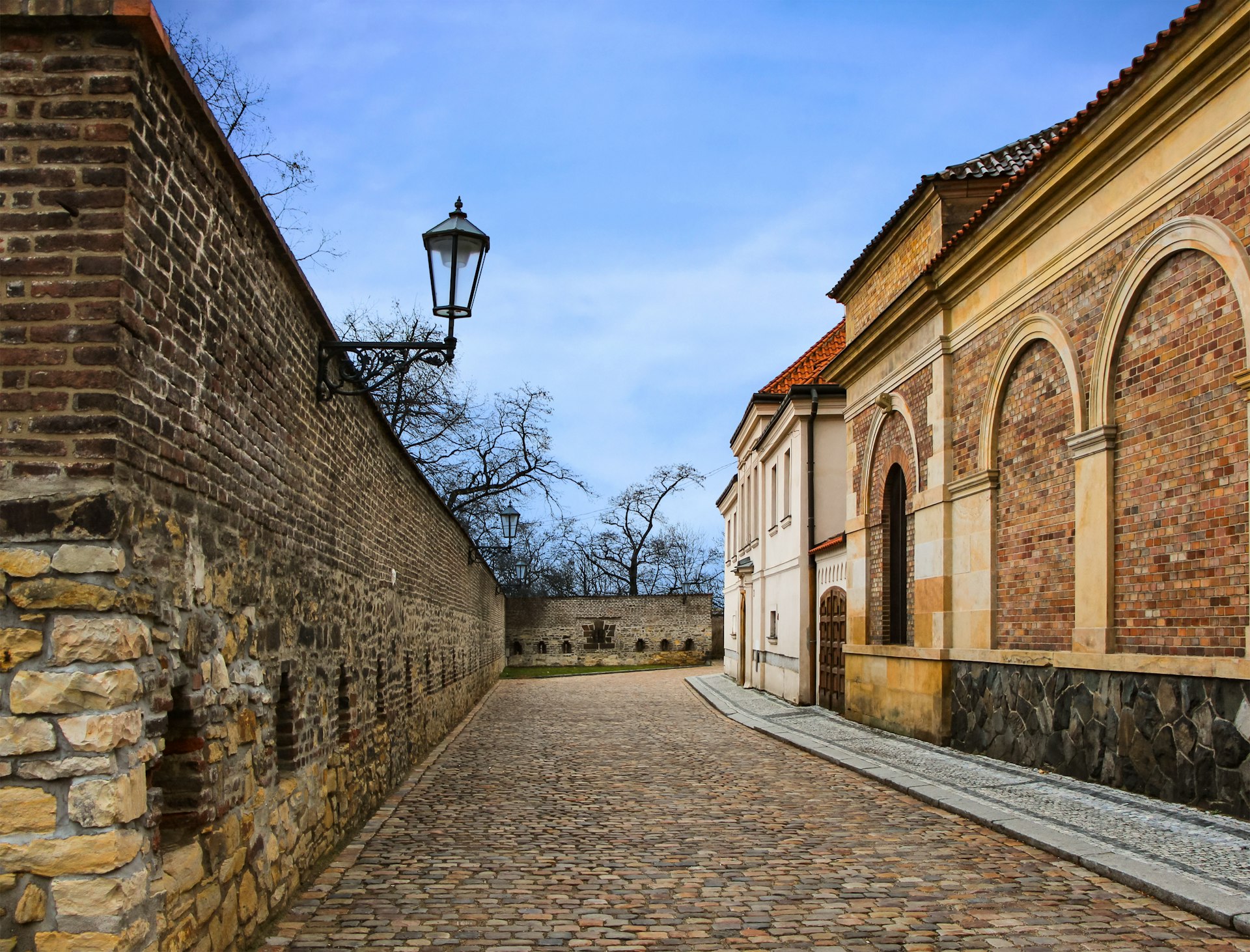 Old traditional street in Prague, Czech Republic, stone wall and сobbles, Vysehrad
