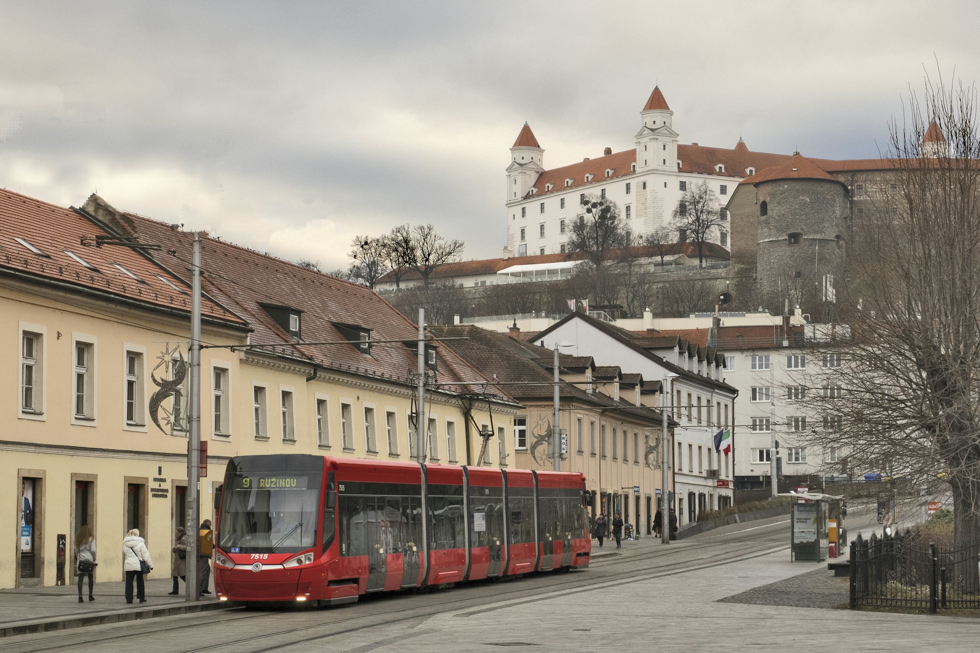 A tram in the Old Town with a view of Bratislava Castle in the distance, Bratislava, Slovakia