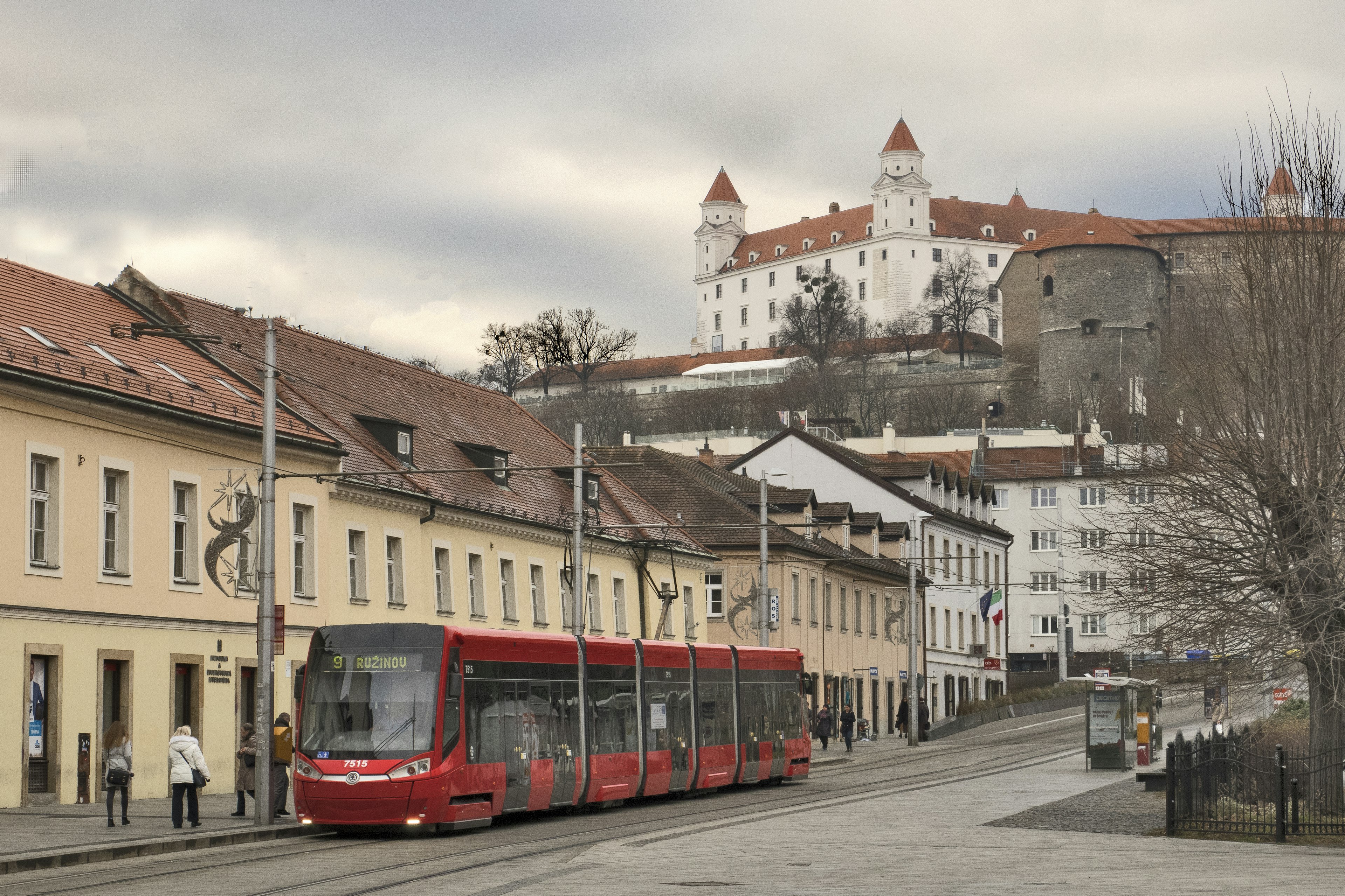 A tram in the Old Town with a view of Bratislava Castle in the distance, Bratislava, Slovakia