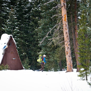 931794408
hyalite canyon recreational area
Young man in 20's backpacking in a snowy forest walks past a triangular wooden hut, Hyalite Canyon Recreational Area, Bozeman, Montana, USA
Young man in 20's backpacking in a snowy forest walks past a triangular wooden hut, Hyalite Canyon Recreational Area, Bozeman, Montana, USA
