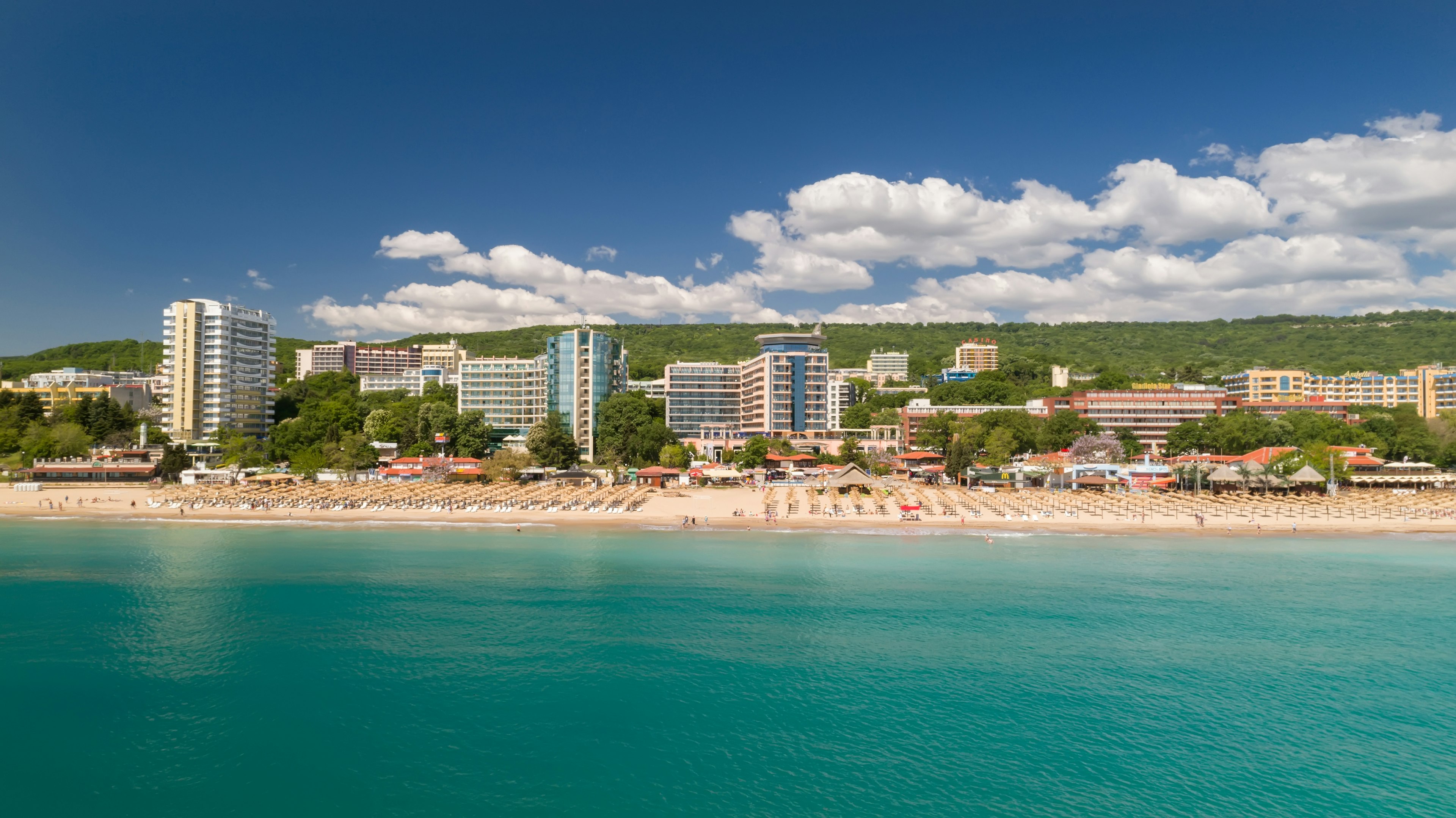 A beach lined with large hotels