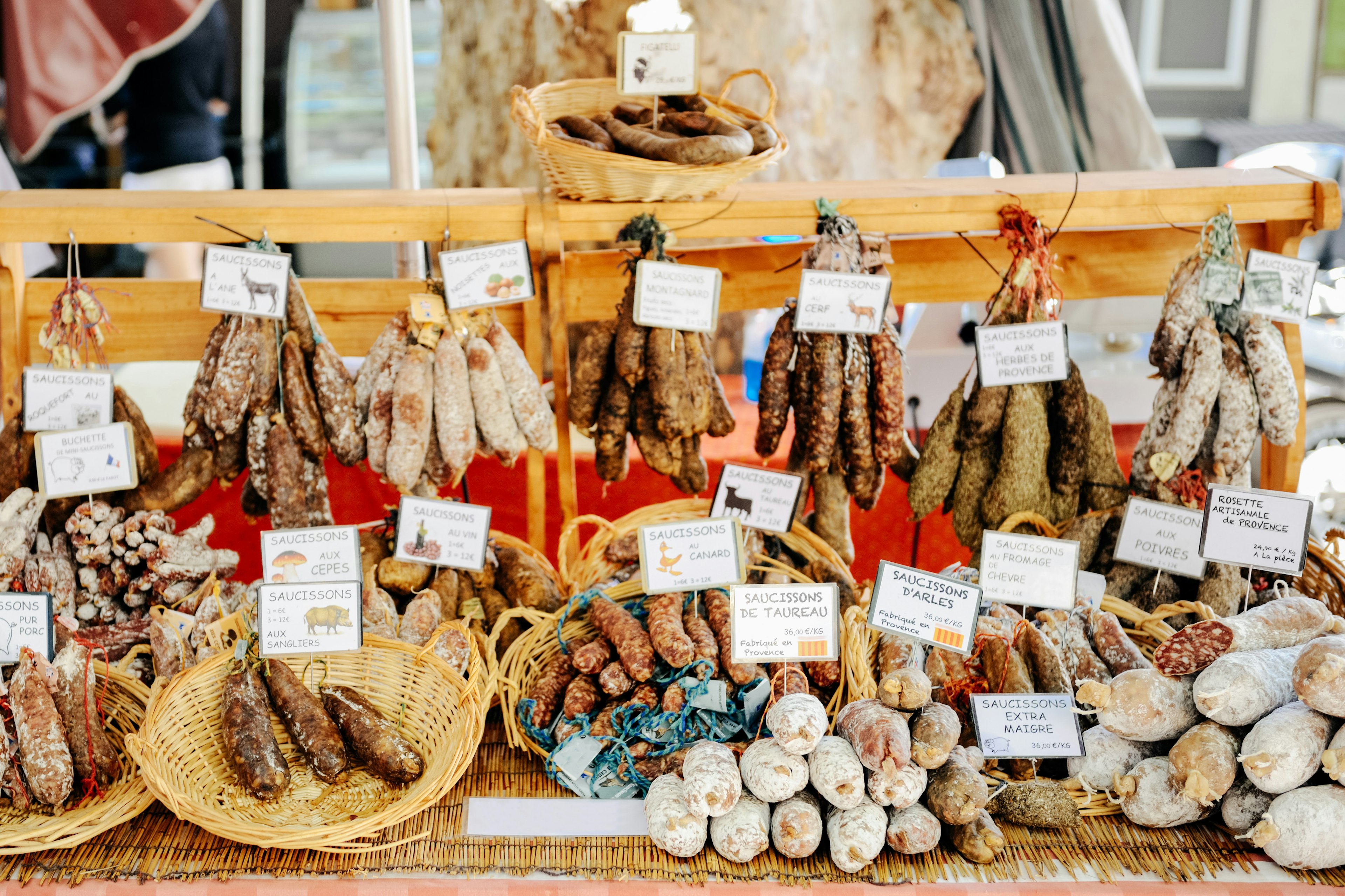 A selection of locally made salamis and sausages on display at a market stall in Aix-en-Provence, France