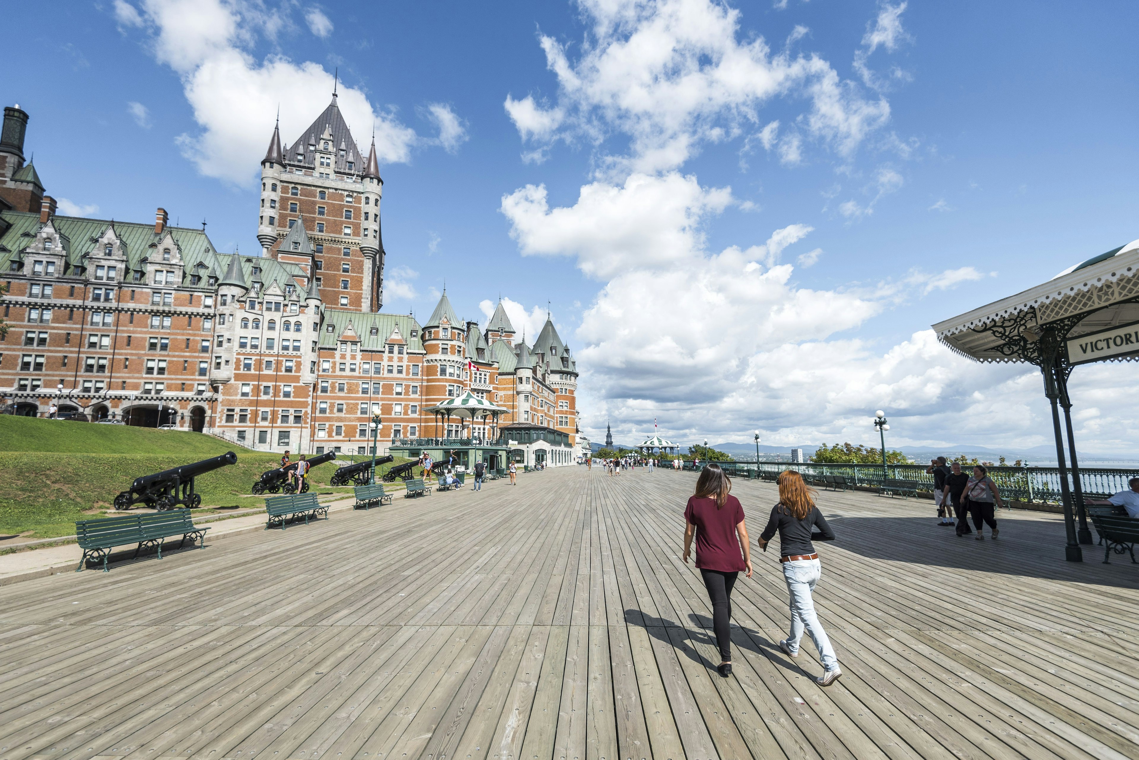 People walk on Terrasse Dufferin past the Château de Frontenac hotel, Québec City, Québec, Canada