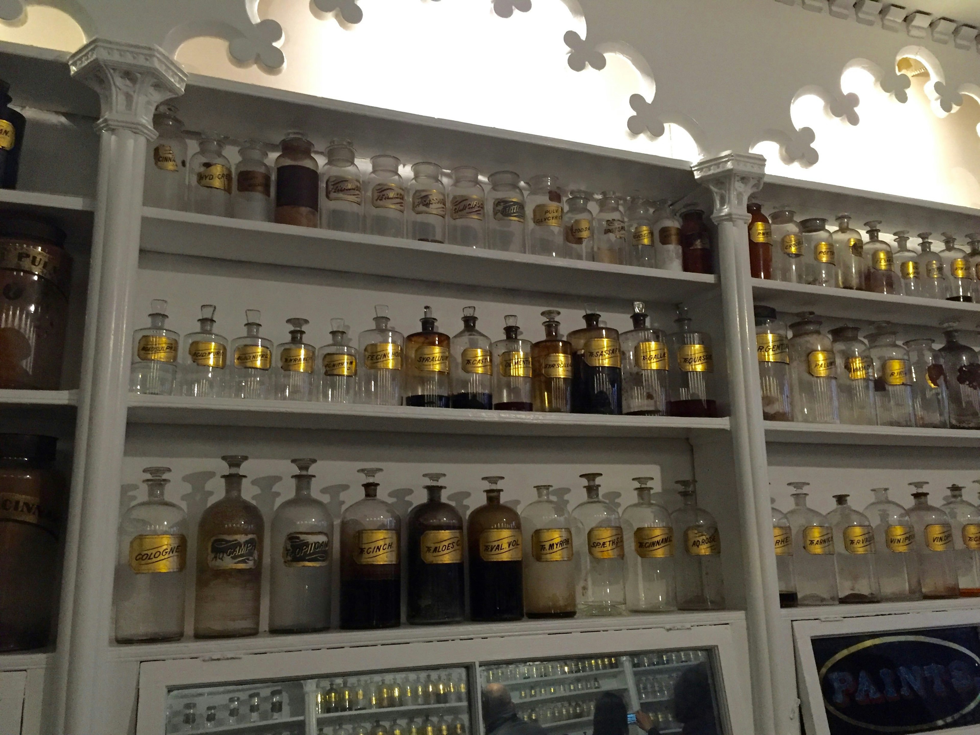 Apothecary shelves with glass bottles at Stabler-Leadbeater Apothecary Museum.