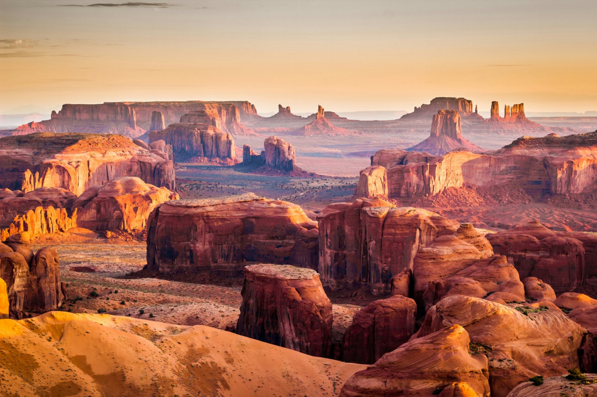 Huge red-colored stacked rocks and outcrops in a desert