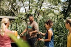 Kiai Collier of Hawaii Land Trust hands out plants to volunteers. Waihee Coastal Dunes and Wetlands Refuge, Wailuku, Maui