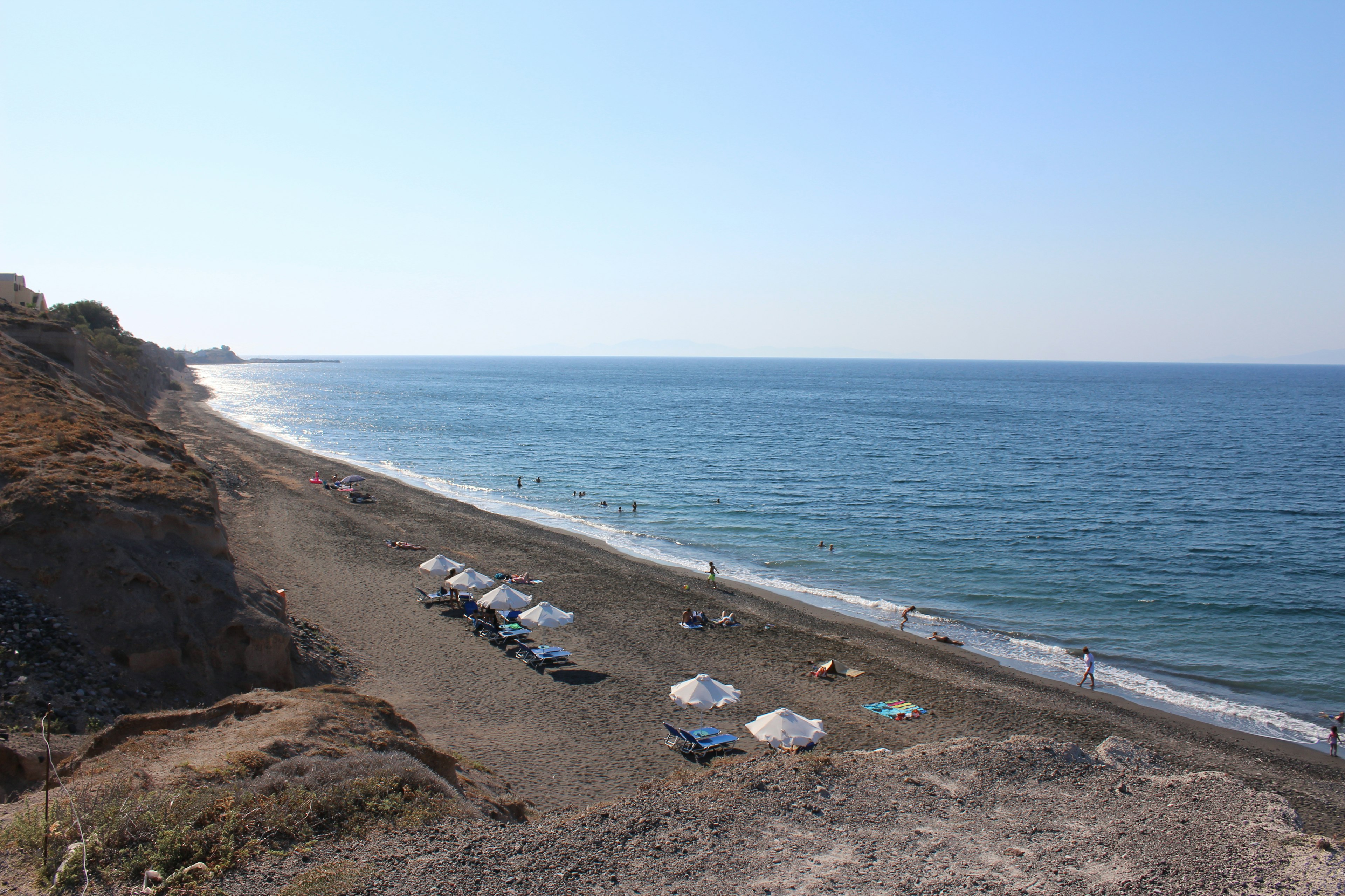 Bexedes beach with a handful of sun loungers on a sunny day