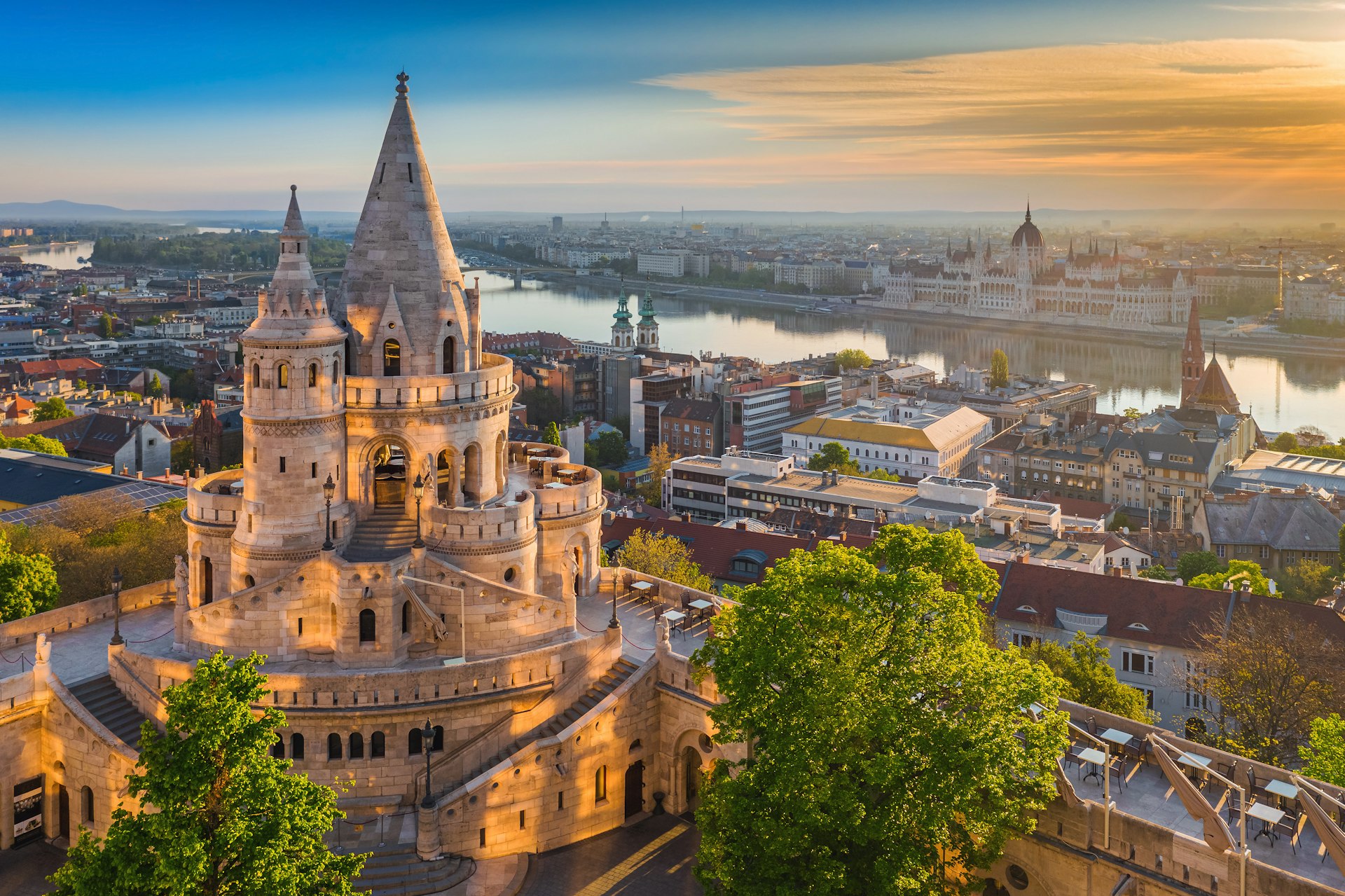 Looking down on Fisherman's Bastion at sunrise, with the Danube beyond