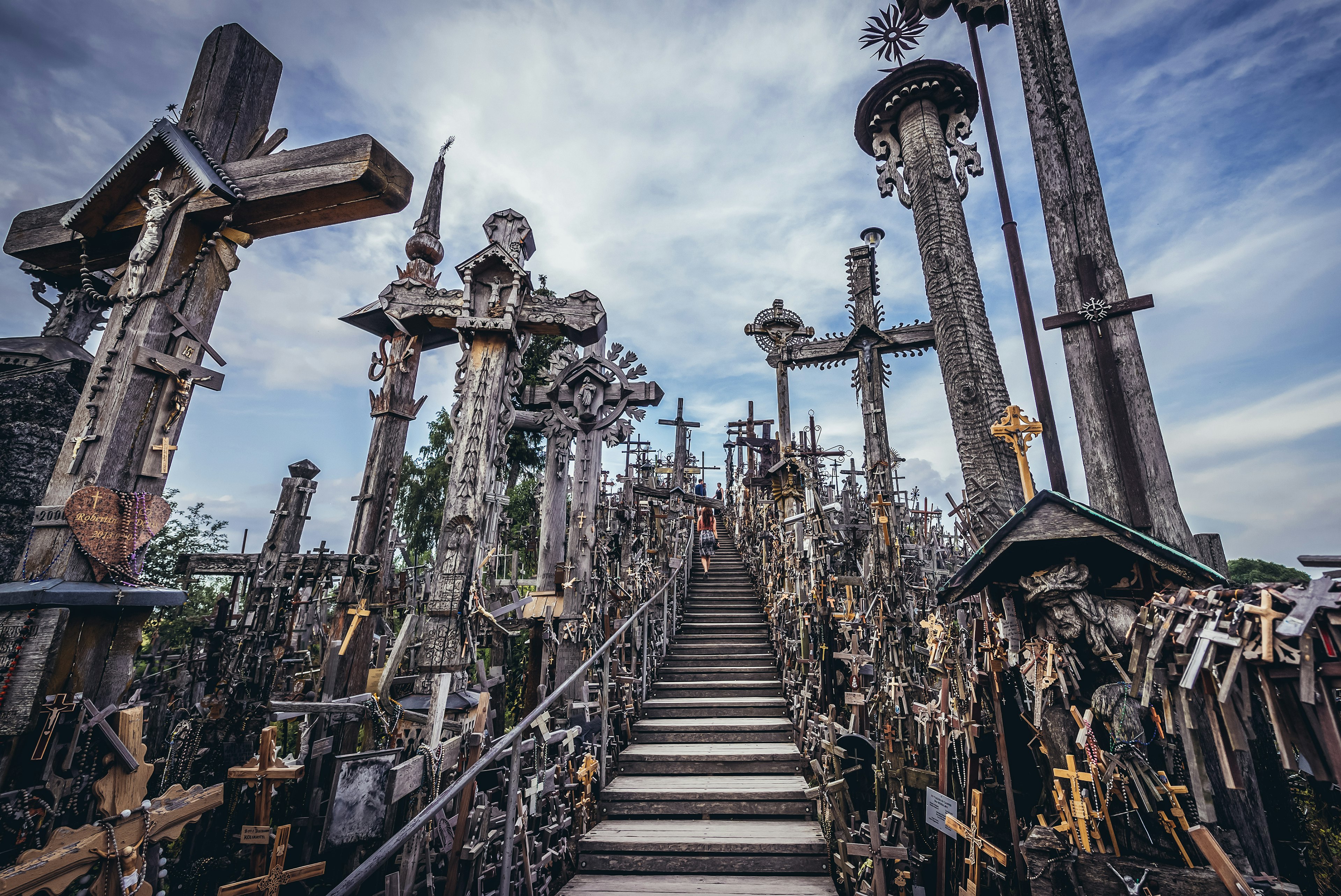 A wooden path leads through countless crosses at the Hill of Crosses, Šiauliai, Lithuania