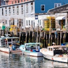 PORTLAND, ME, USA, AUGUST 10, 2015: Lobster fishing boats are berthed at dockside in Portland Maine's harbor after delivering the day's catch., License Type: media_digital, Download Time: 2024-07-28T13:40:32.000Z, User: bhealy950, Editorial: true, purchase_order: 65050, job: Lonely Planet Online Editorial, client: First-time guide to Portland, other: Brian Healy