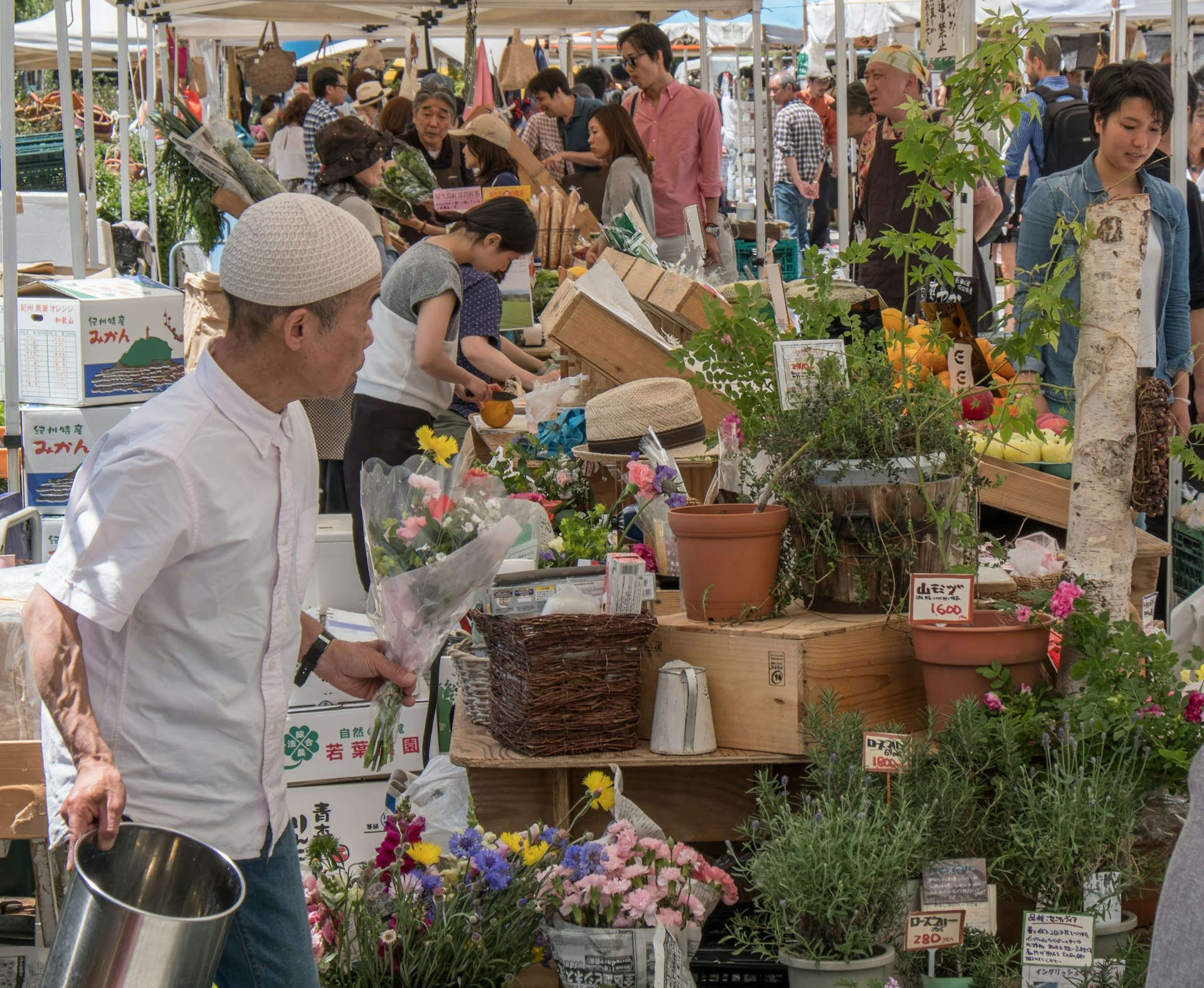 Man at flower market in Tokyo Japan