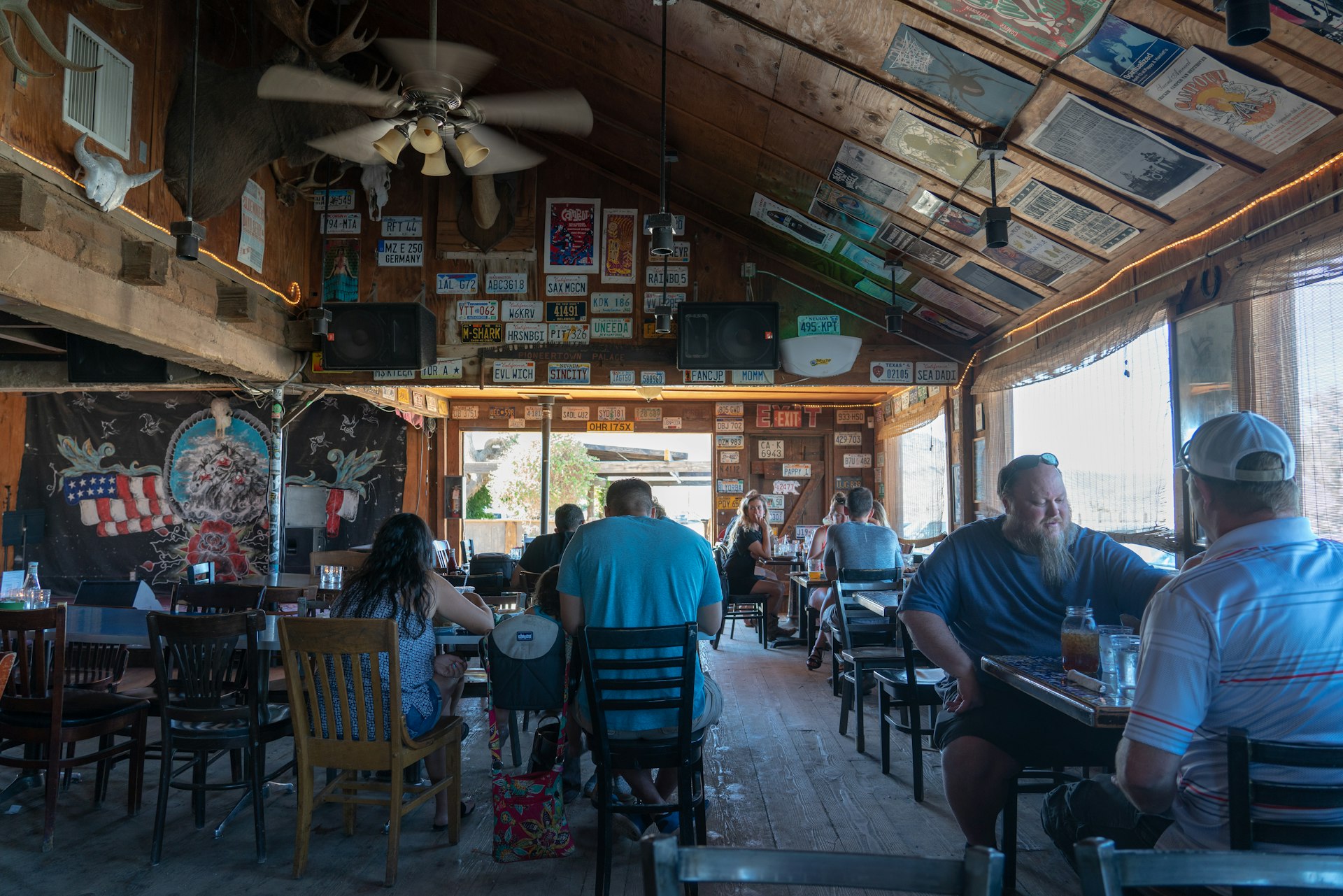People dining at Pappy & Harriet’s restaurant and music venue, Pioneertown, California, USA