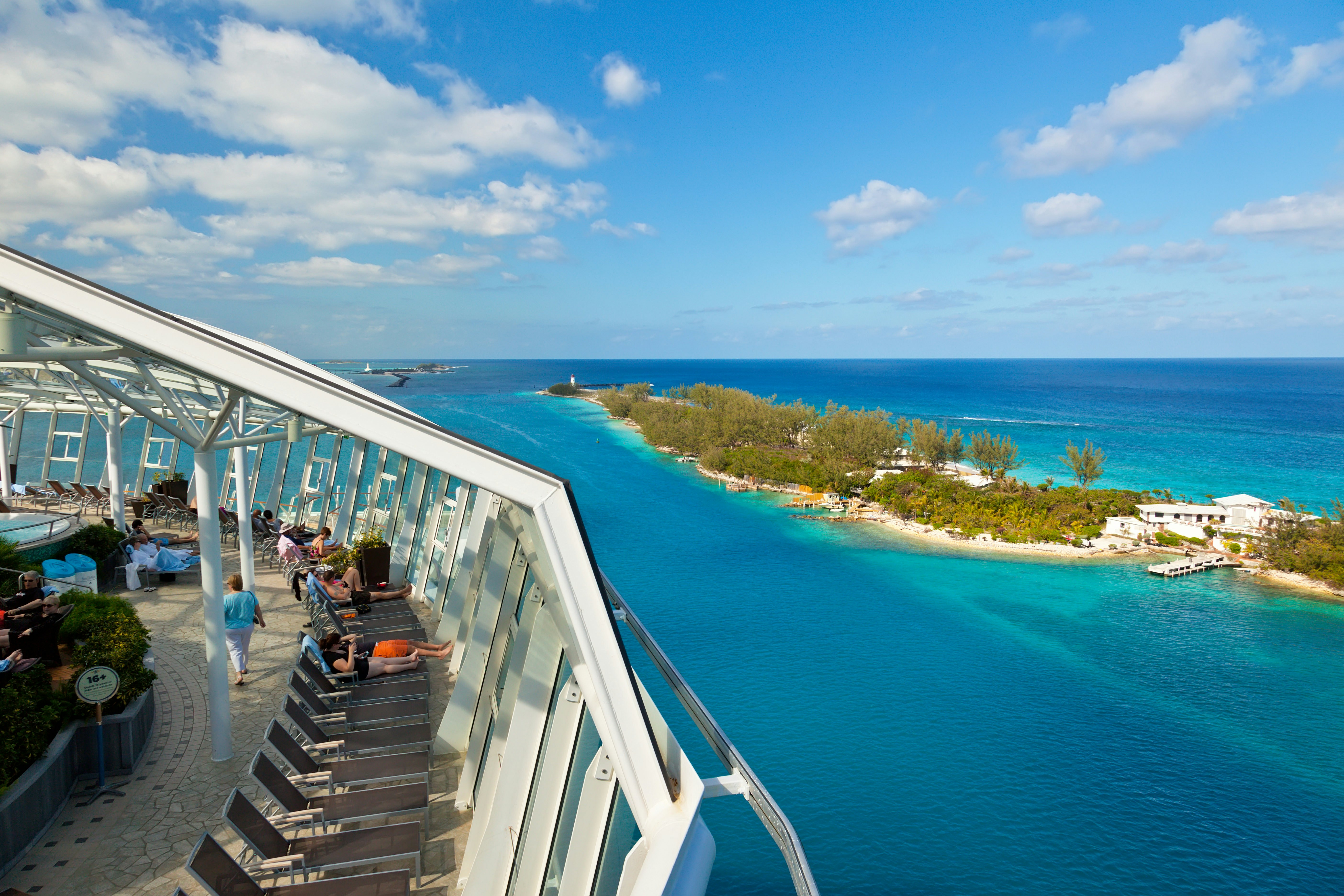 Passengers relax as the Oasis of the Seas departs the Bahamas