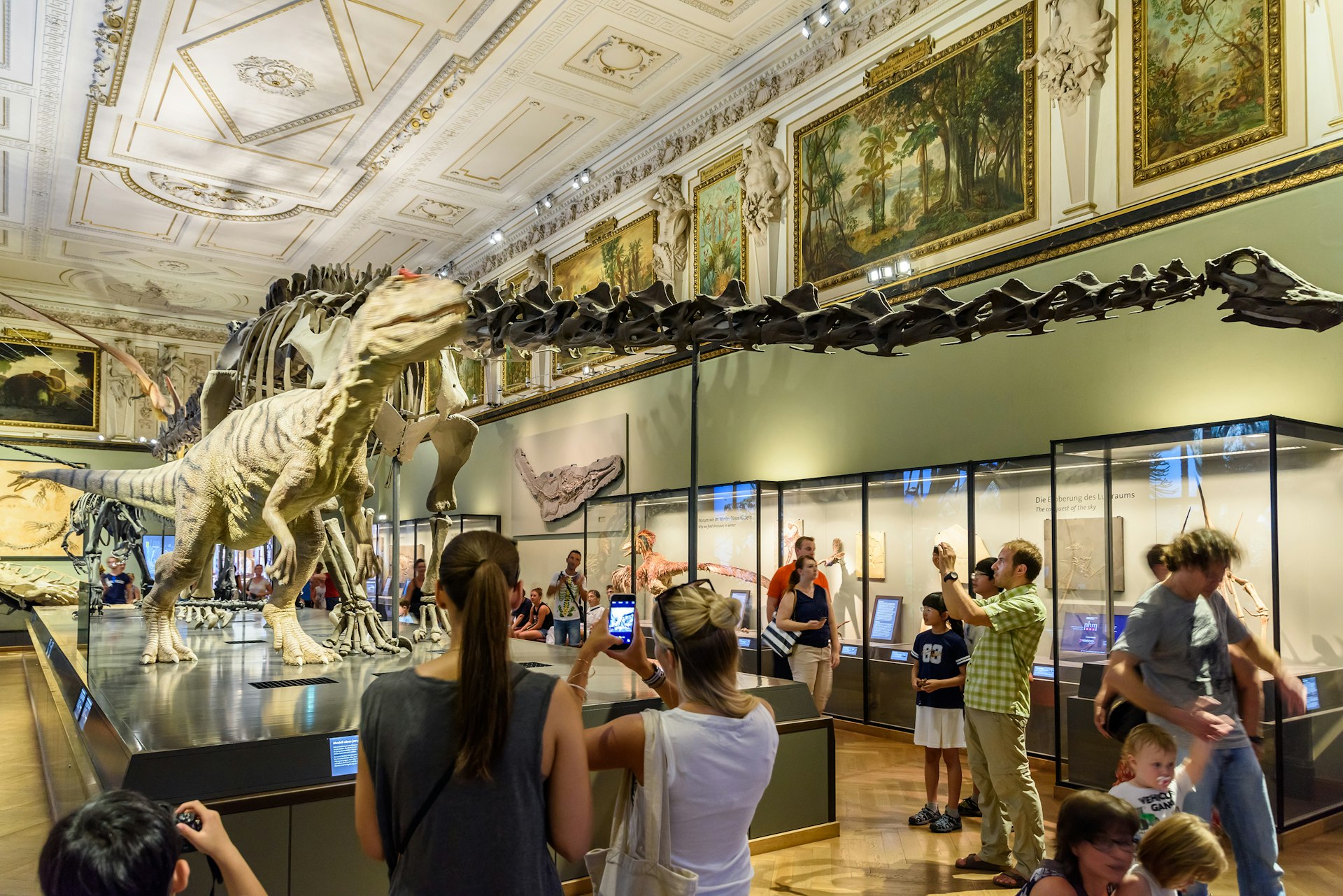 People visiting the dinosaur exhibit at the Naturhistorisches Museum, Vienna, Austria