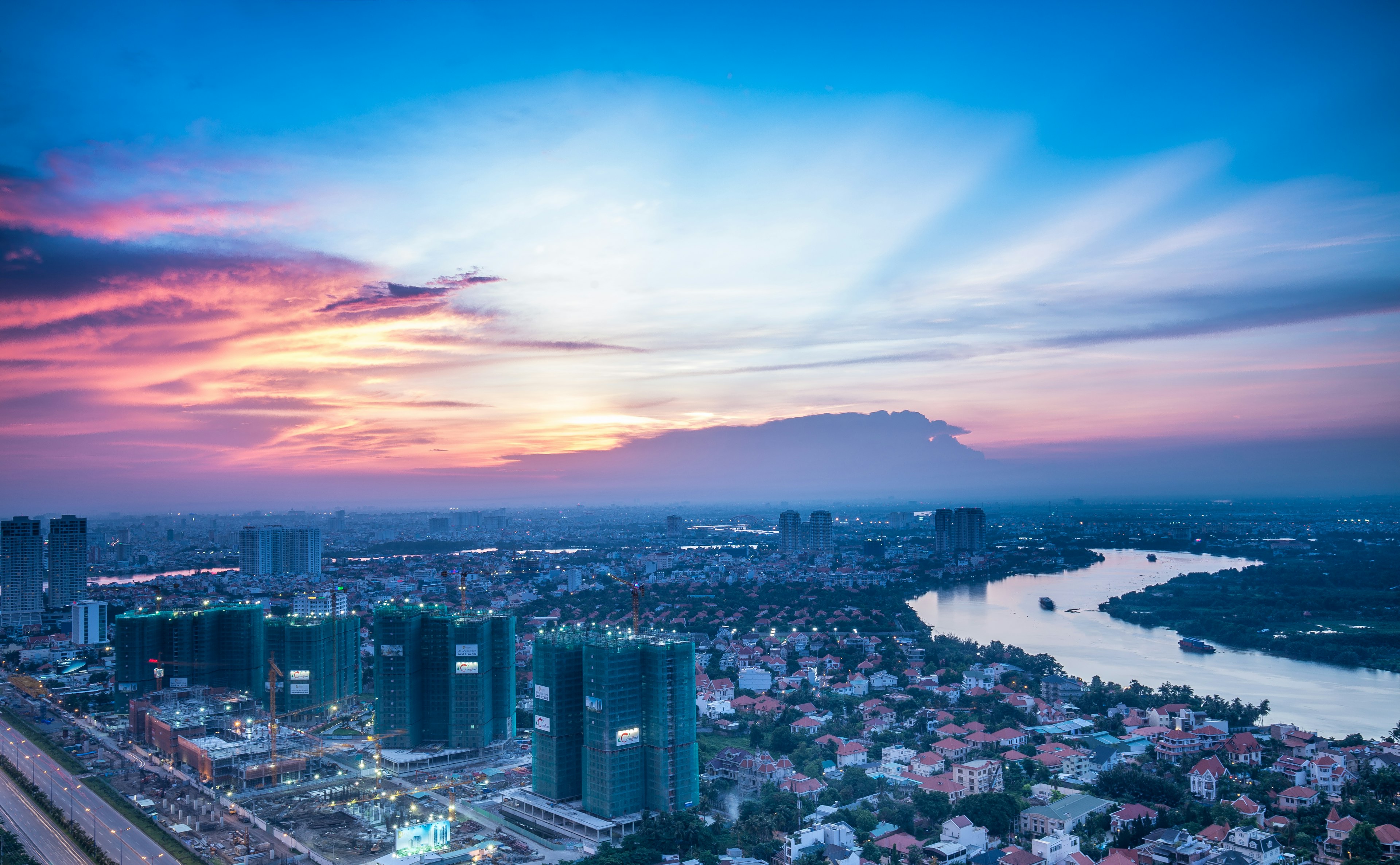 500px Photo ID: 114183909 - The buildings and whole area ahead is belong to District 2, and Thanh Da Island of Binh Thanh District of Ho Chi Minh City. A weekend day in the summer almost have been gone.