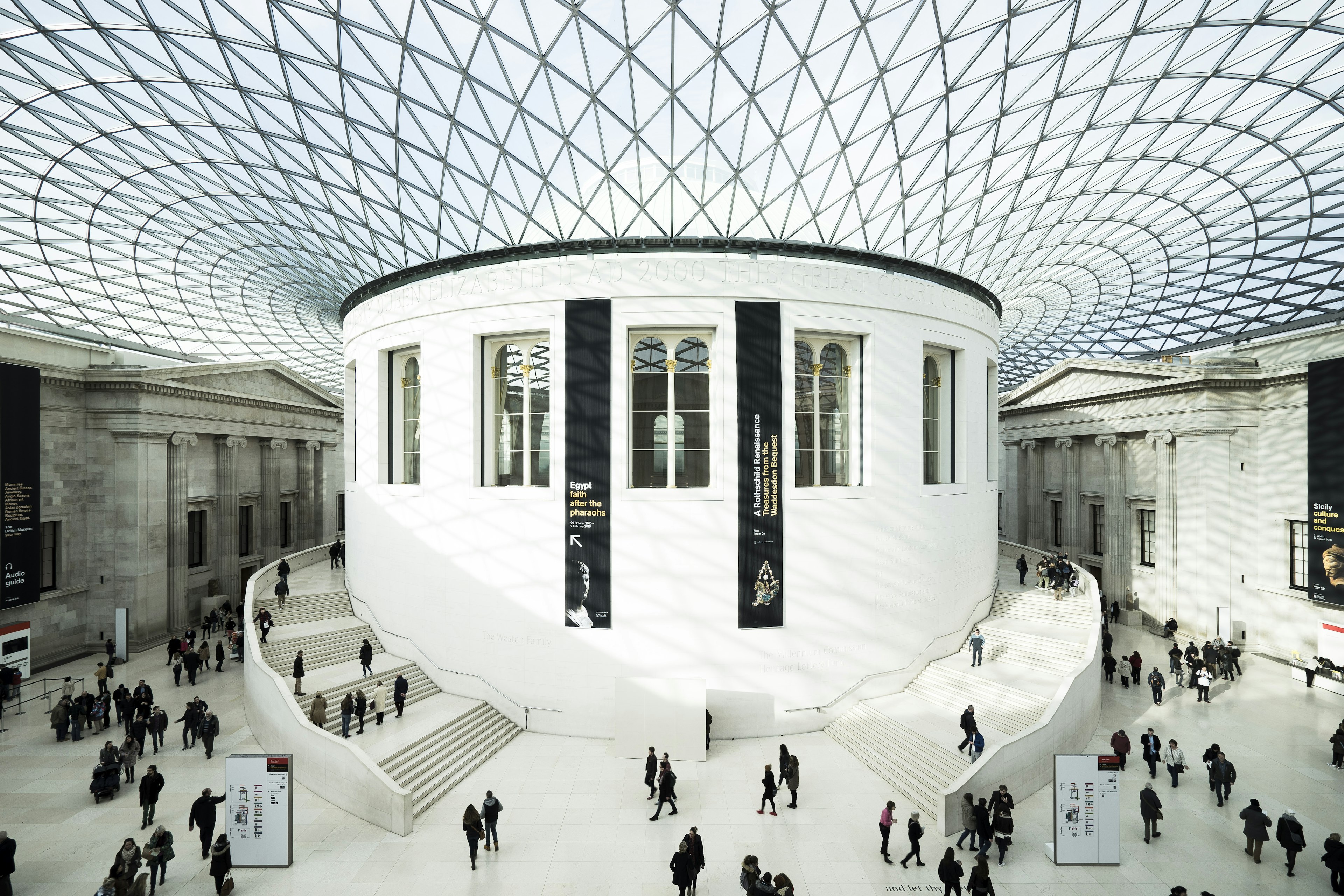 A large room with a curved glass ceiling