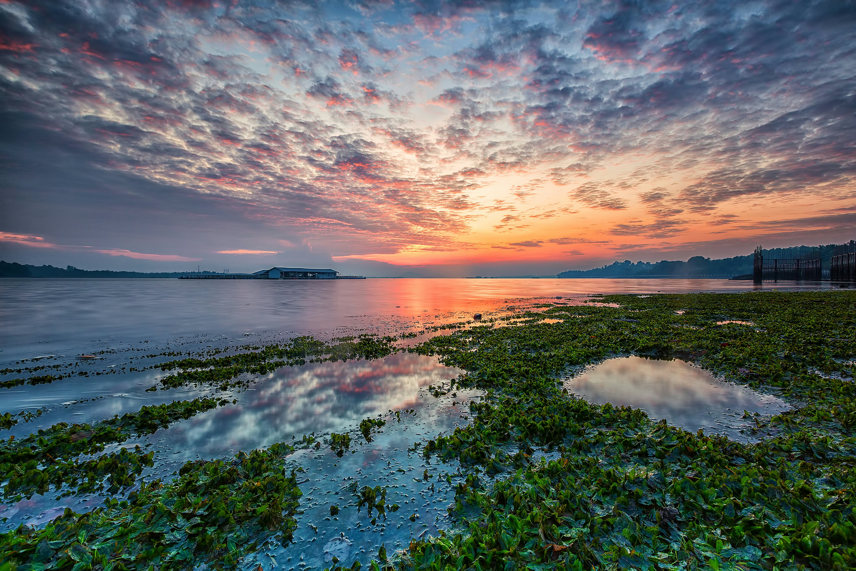 Sunrise over Singapore and clouds formation