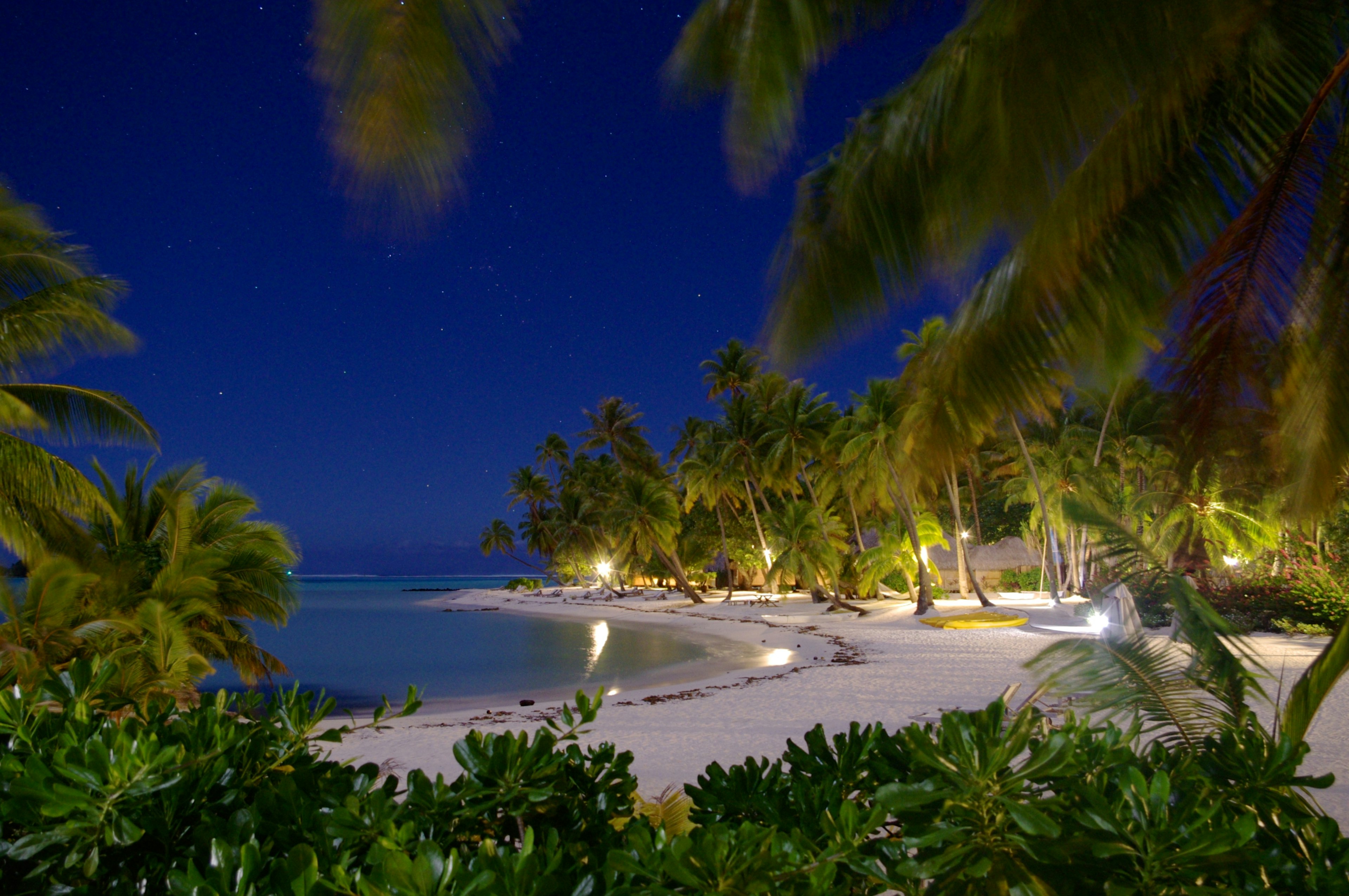 A beautiful beach illuminated at night on Bora Bora