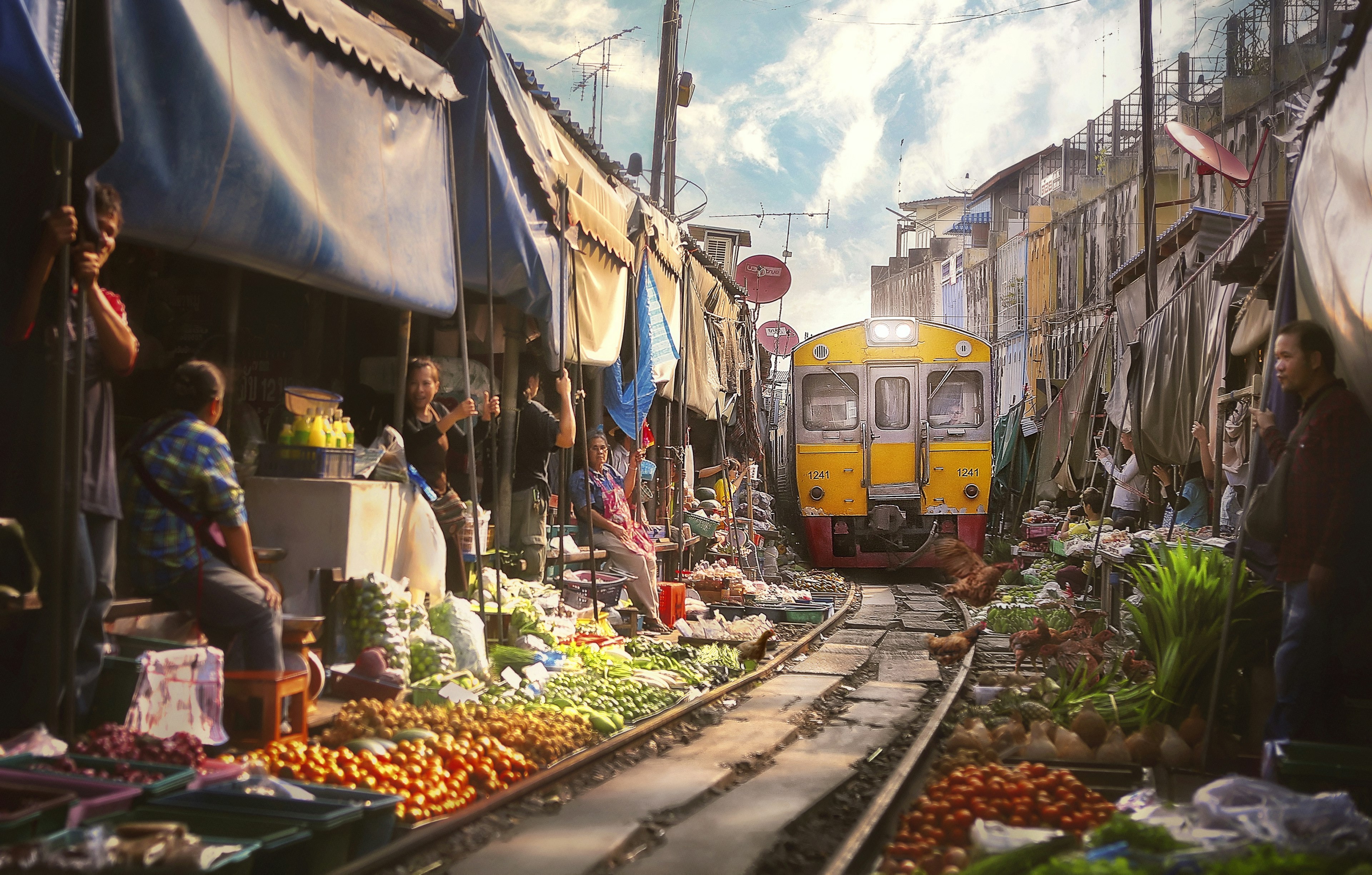 The Bangkok train arriving at the Samut Sakhon Railway Market