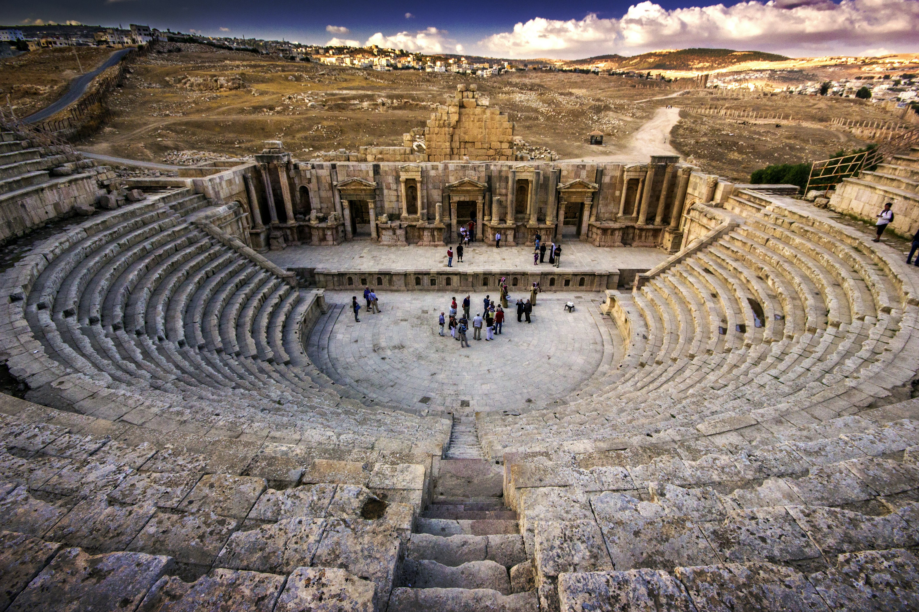 Visitors in the amphitheater, a major site among the ruins of the ancient Roman city of Jerash, Jordan