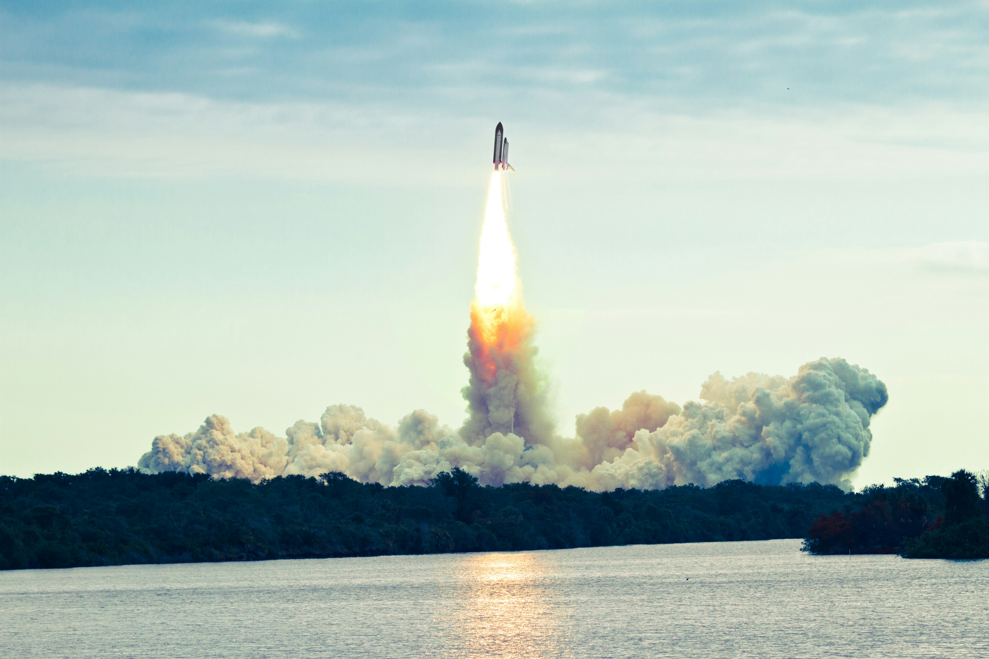 A space shuttle lifting off from the Kennedy Space Center