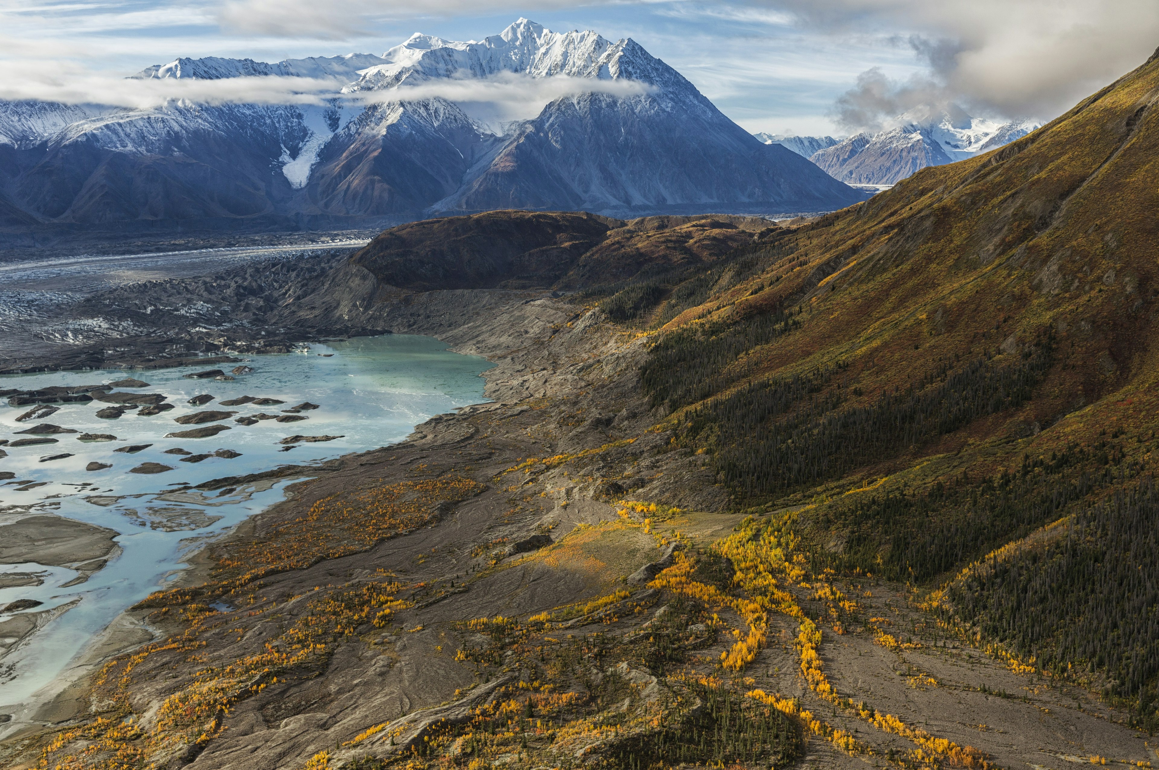 A snow-capped mountain in an empty landscape