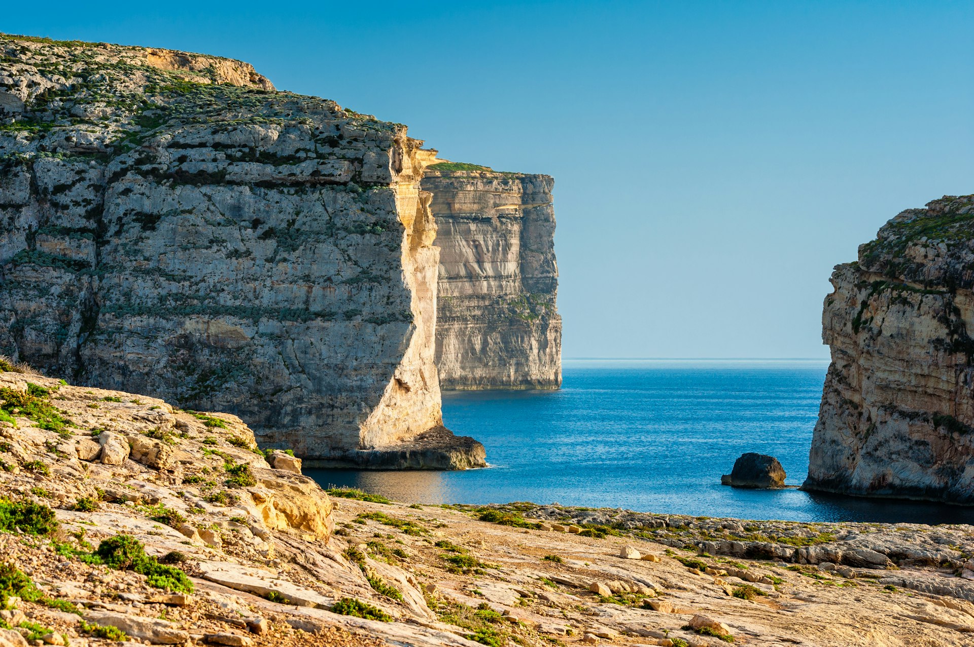 Rocky cliffs on Gozo with bright sunlight. 