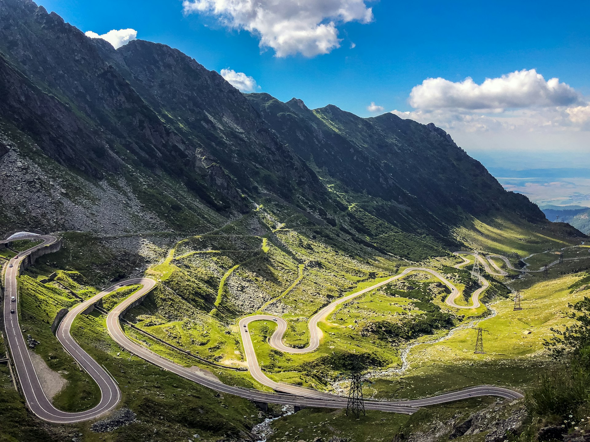 The winding path of the Transfagarasan mountain road, Romania, in the sunshine.