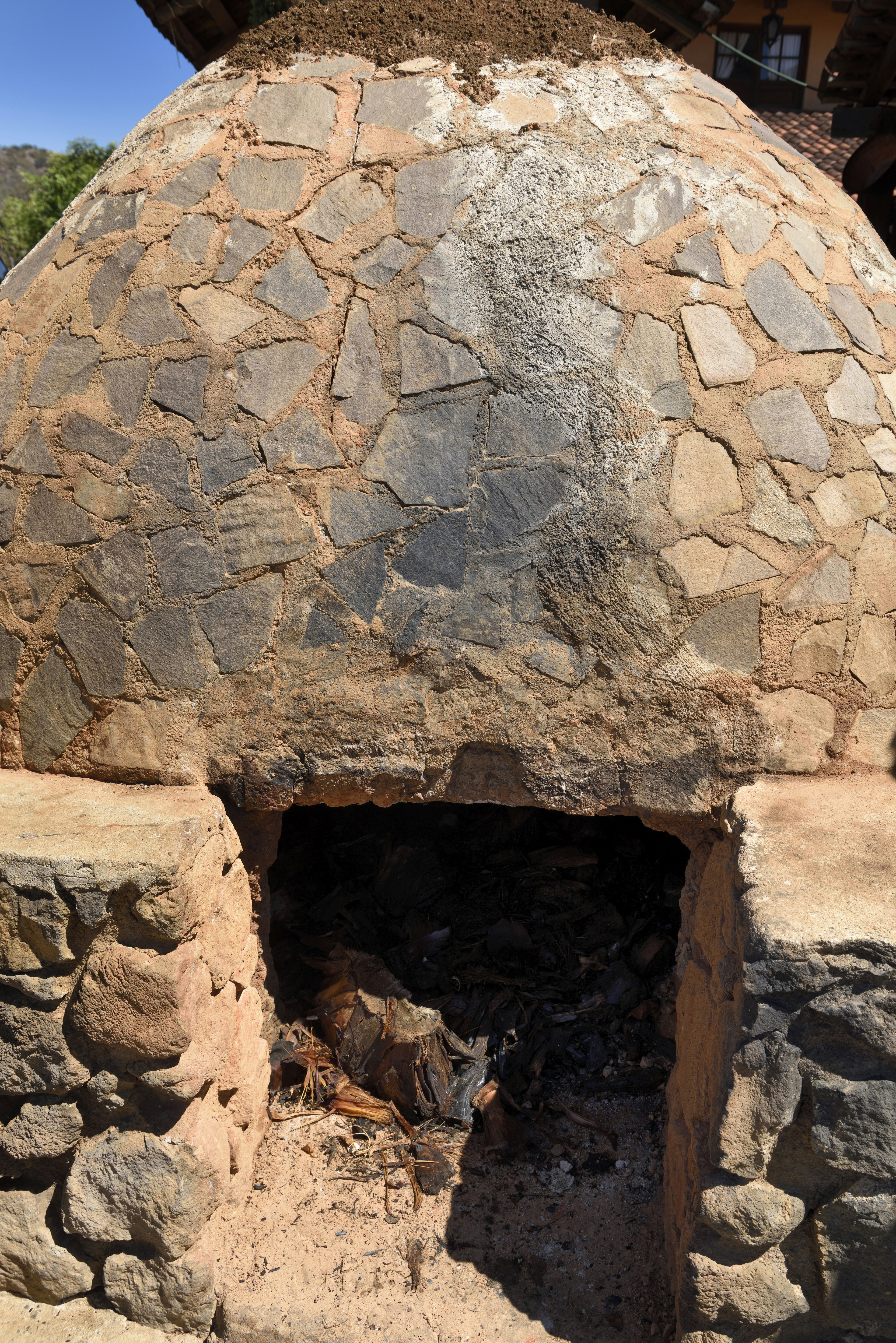 Stone beehive oven for cooking agave to make Tequila in Jalisco Mexico