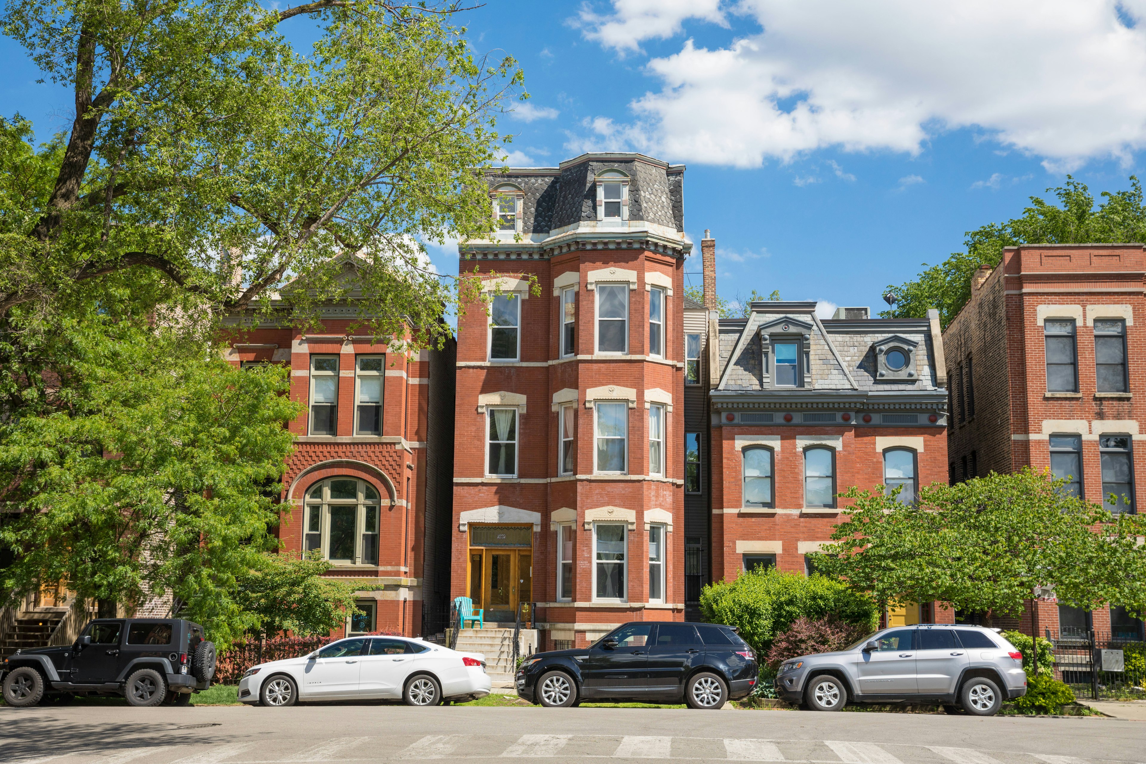 Tall brownstone apartment facades in Wicker Park, Chicago.