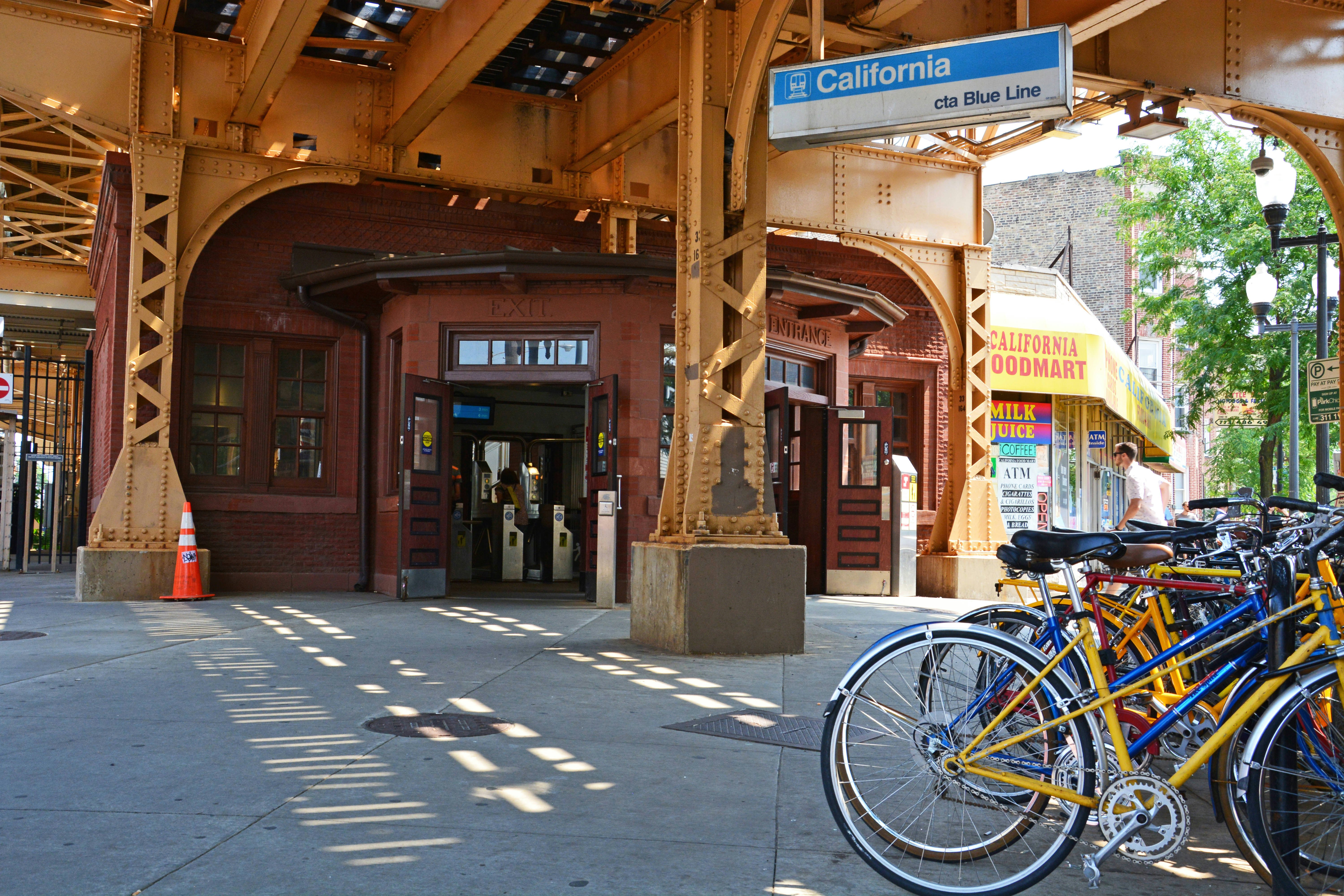 Commuter bicycles parked outside the entrance to the California L Train Station on Chicago's Blue Line in the Logan Square neighborhood