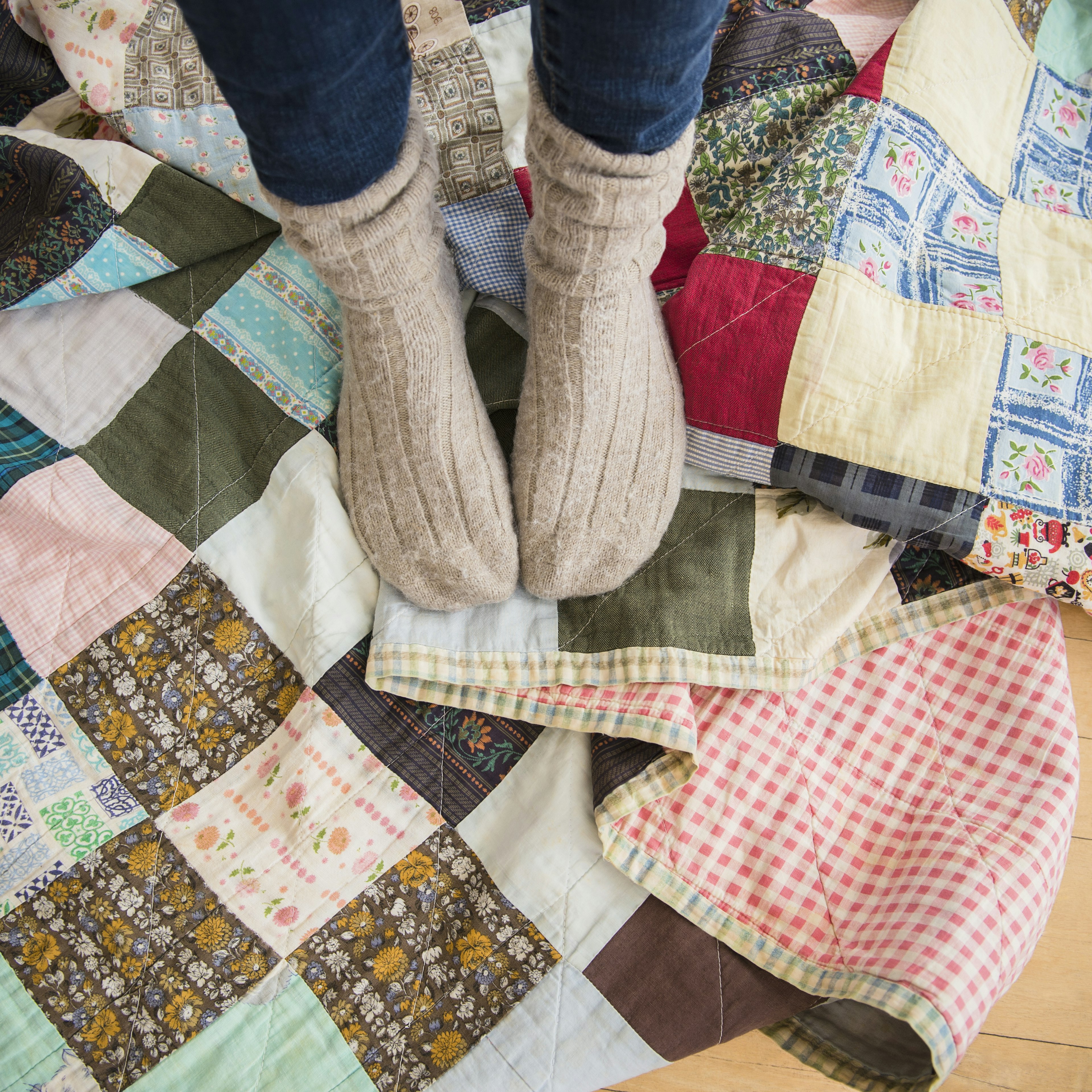 Elevated view of woman's legs wearing woolen socks