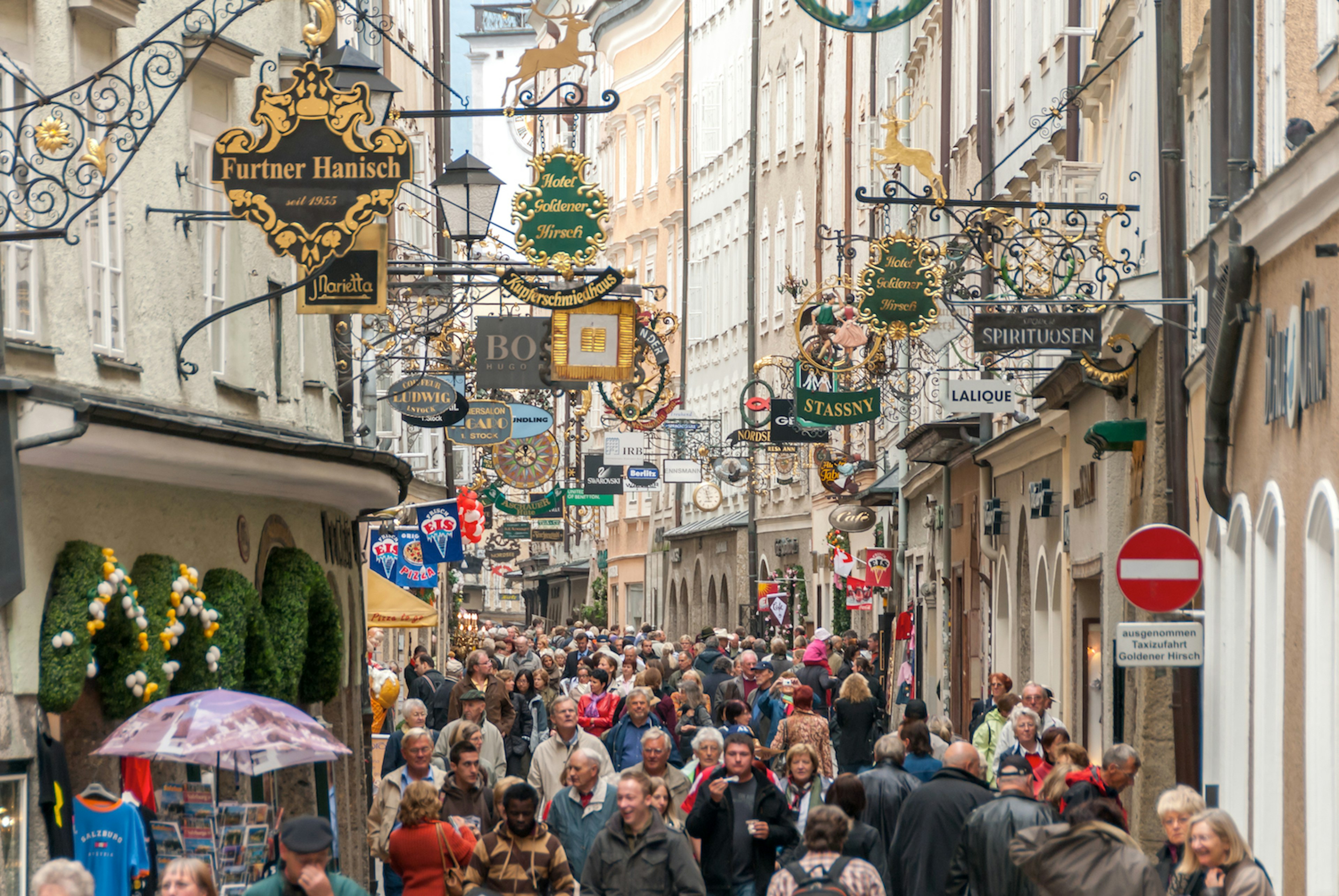 Tourists on a pedestrianized street in the old town of Salzburg, Salzburgerland, Austria, Europe