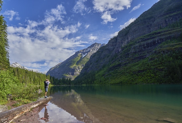 Family on the shore of Avalanche Lake in Glacier National Park