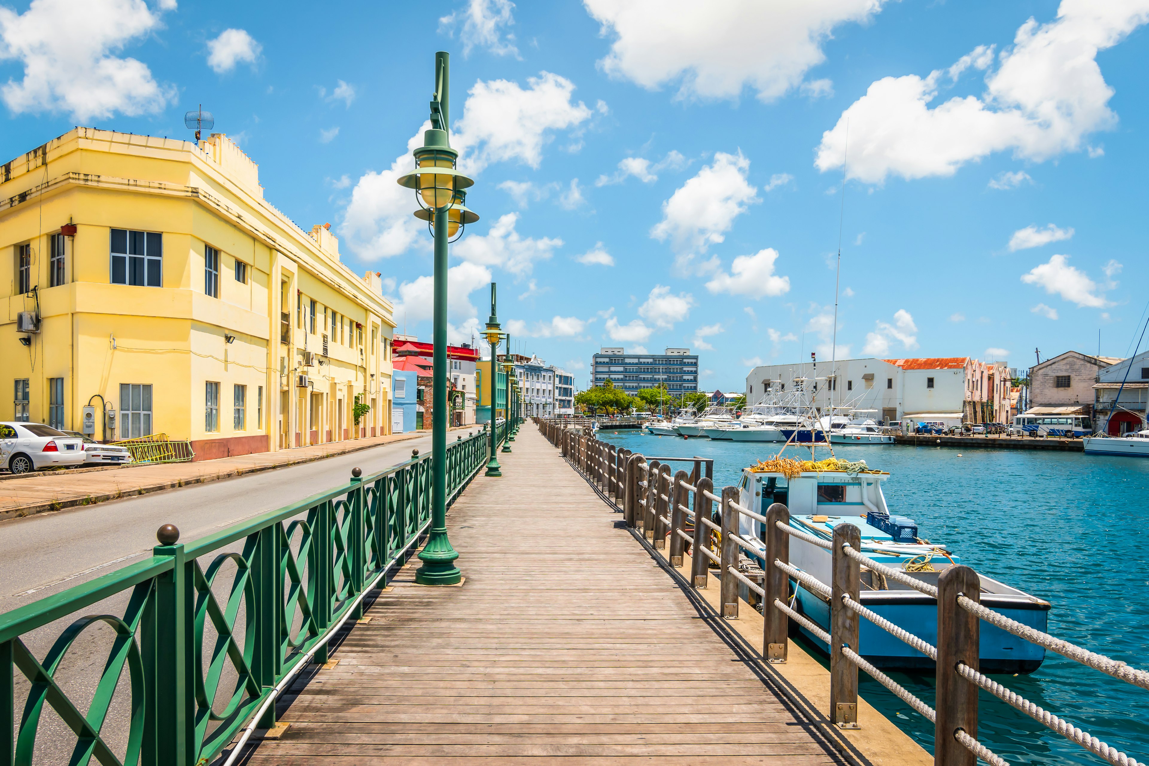 Bright image of wooden promenade at the waterfront of Bridgetown in Barbados.