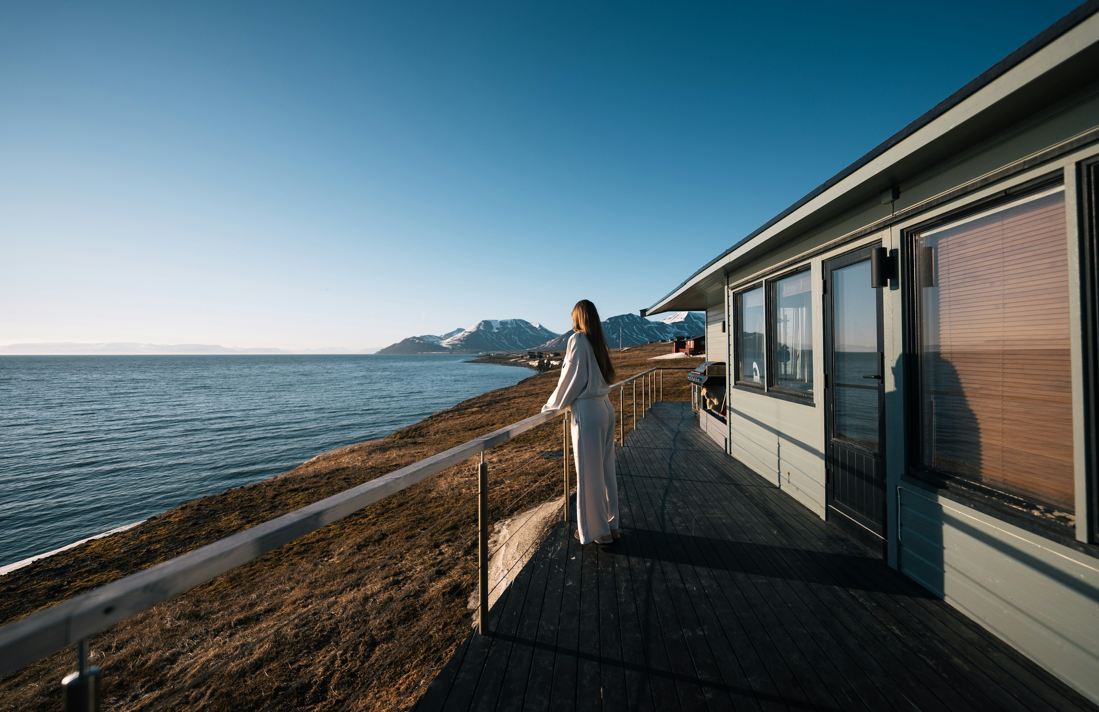 Cecilia enjoying the Midnight Sun outside her cabin in Svalbard