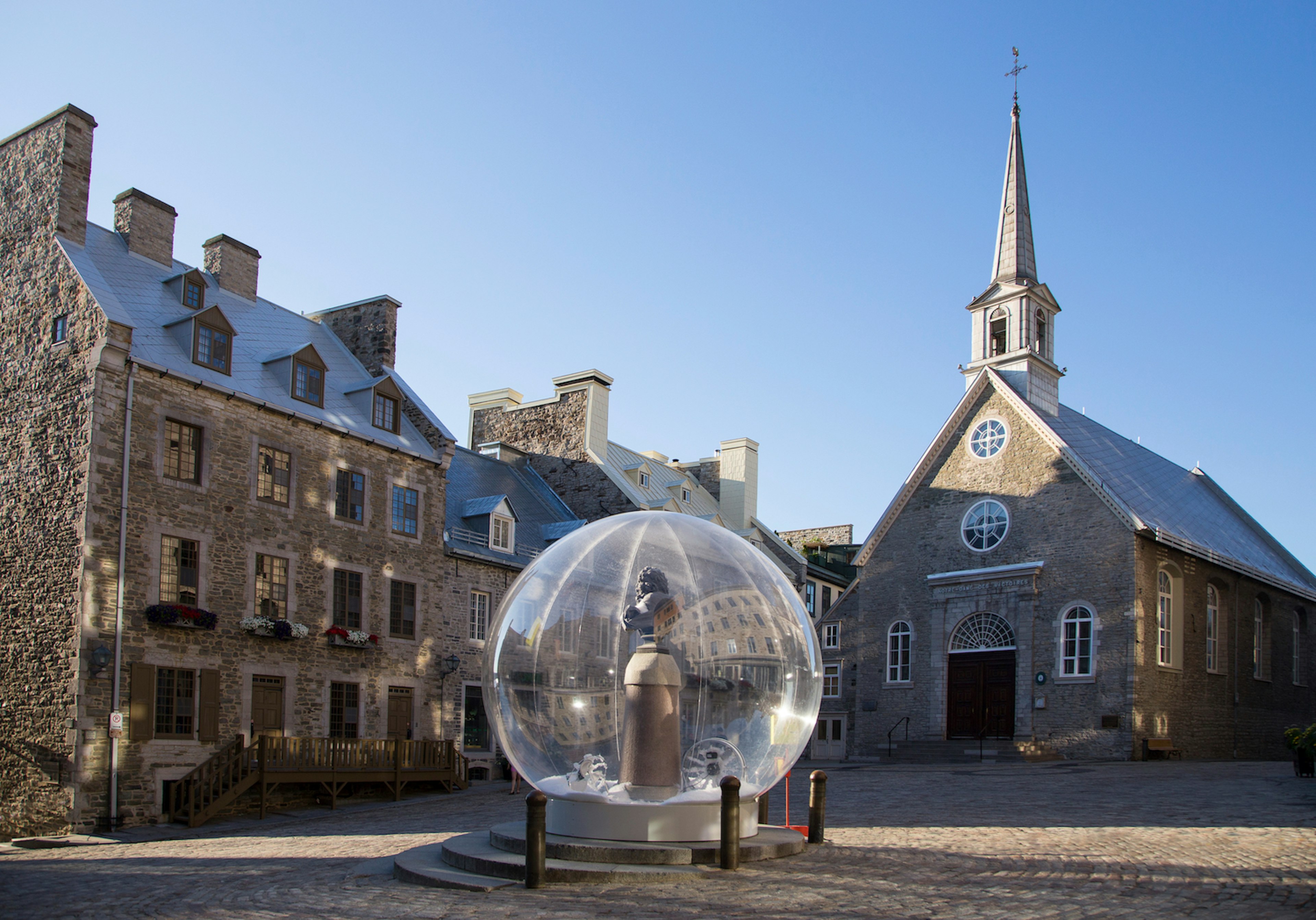 A Louis XIV bust encased in a snow bubble for the “Eternal Snow” installation during the Passages Insolites art show in Place Royale, Old ϳé, ϳé City, ϳé, Canada