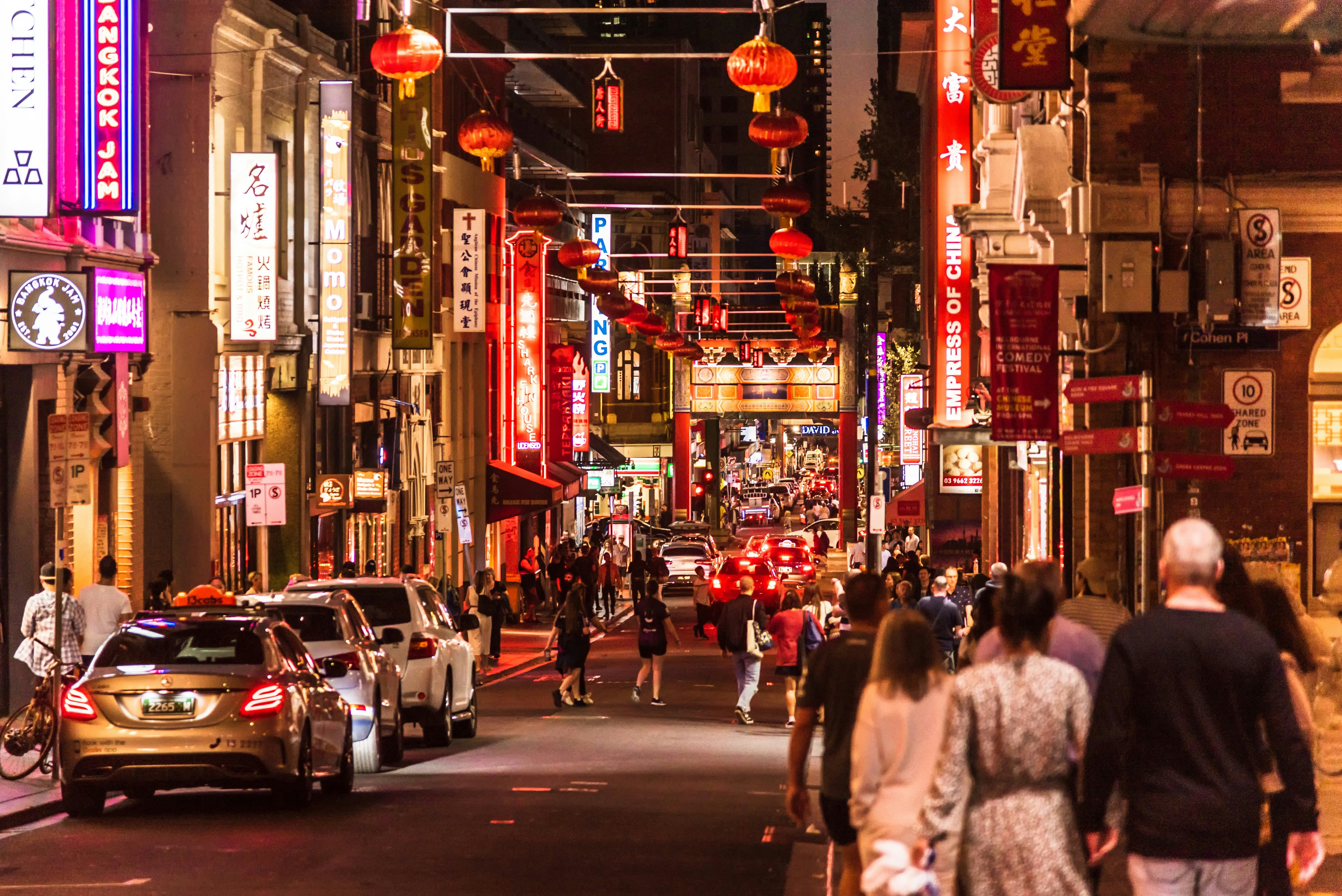 The many signs, lights and lanterns in the chinatown area in the centre of Melbourne in the early evening.