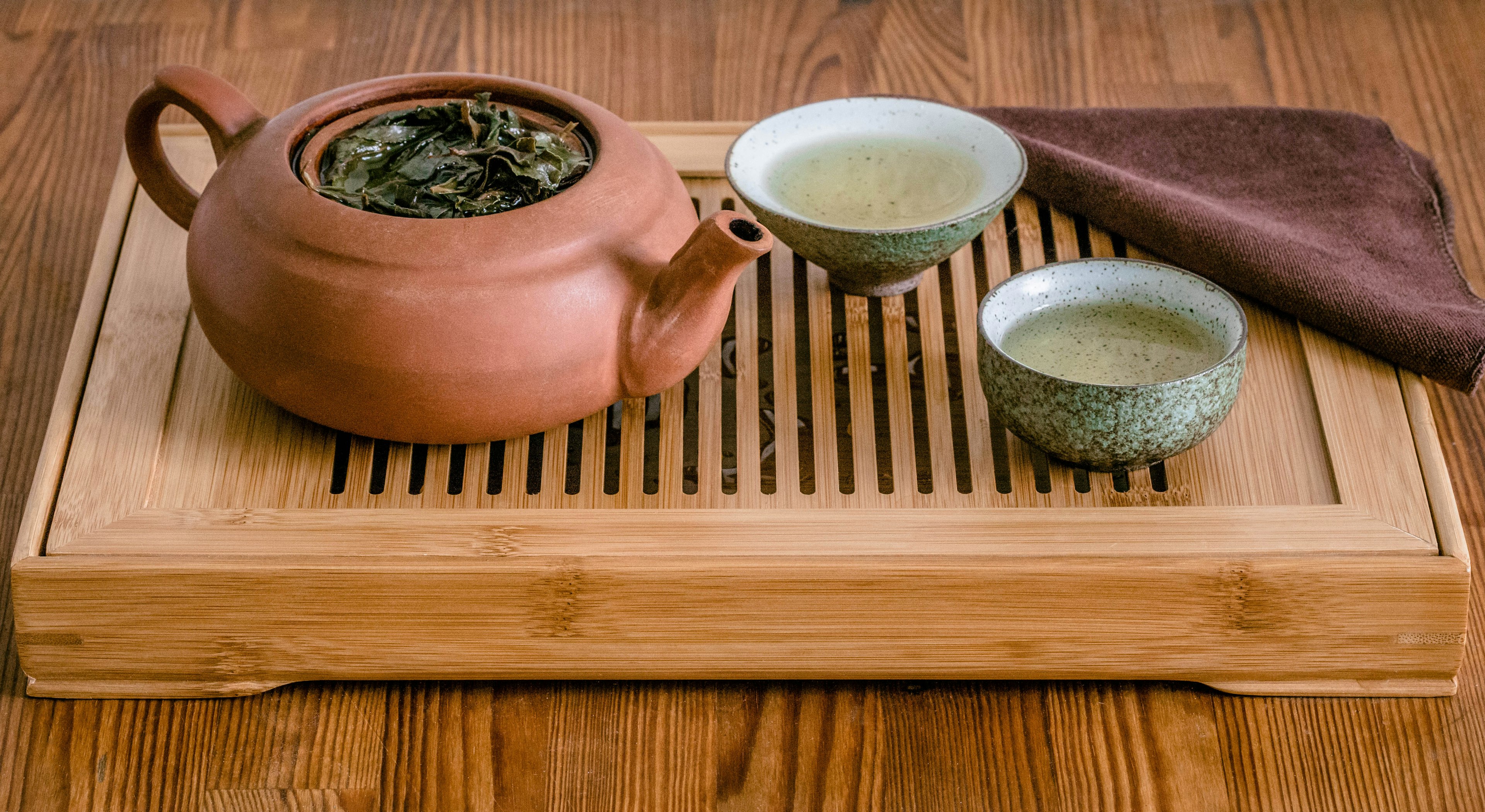 Chinese Gongfu tea ceremony with Oolong tea on chaban table