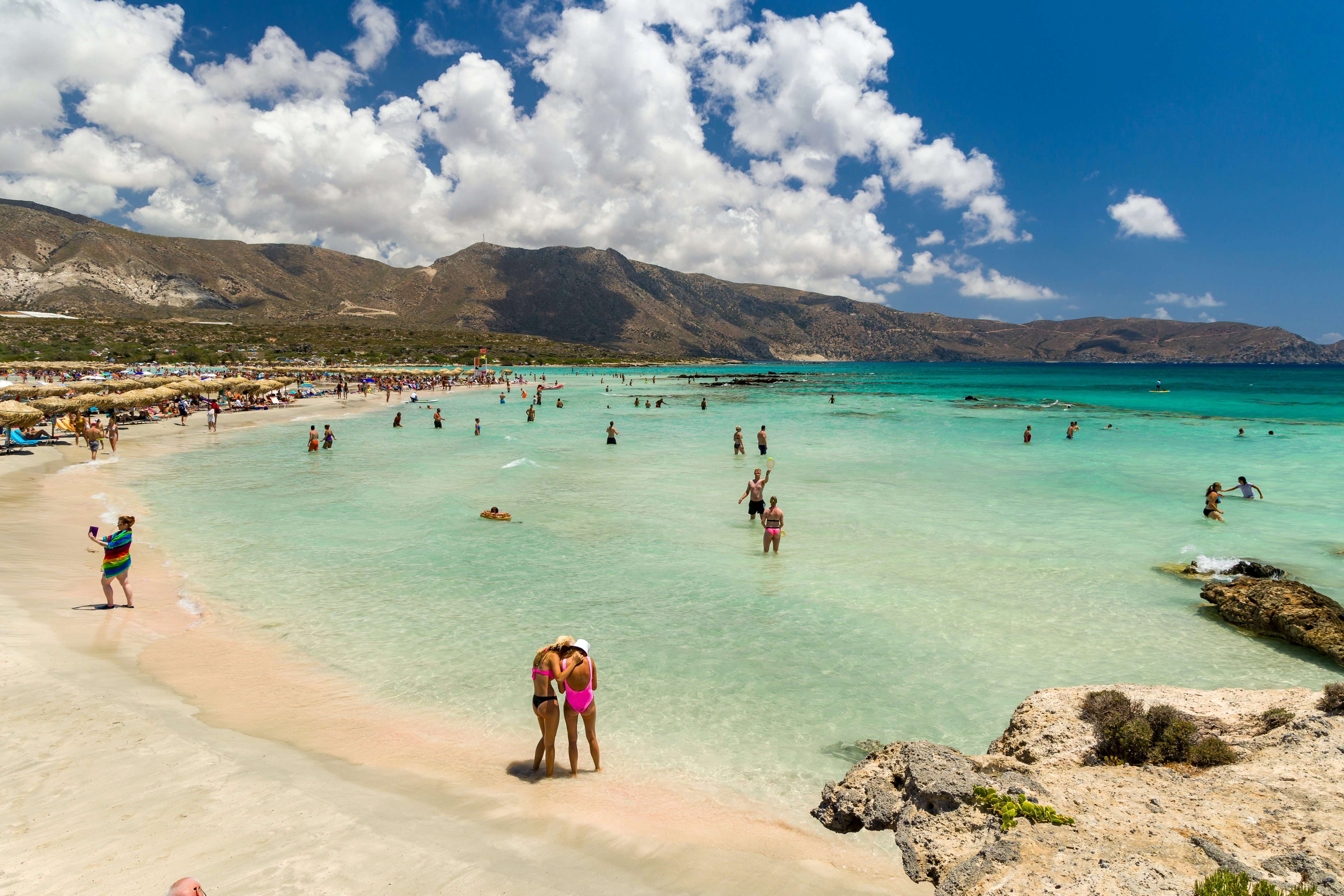 People on the beach by the lagoon at Elafonisi, Crete