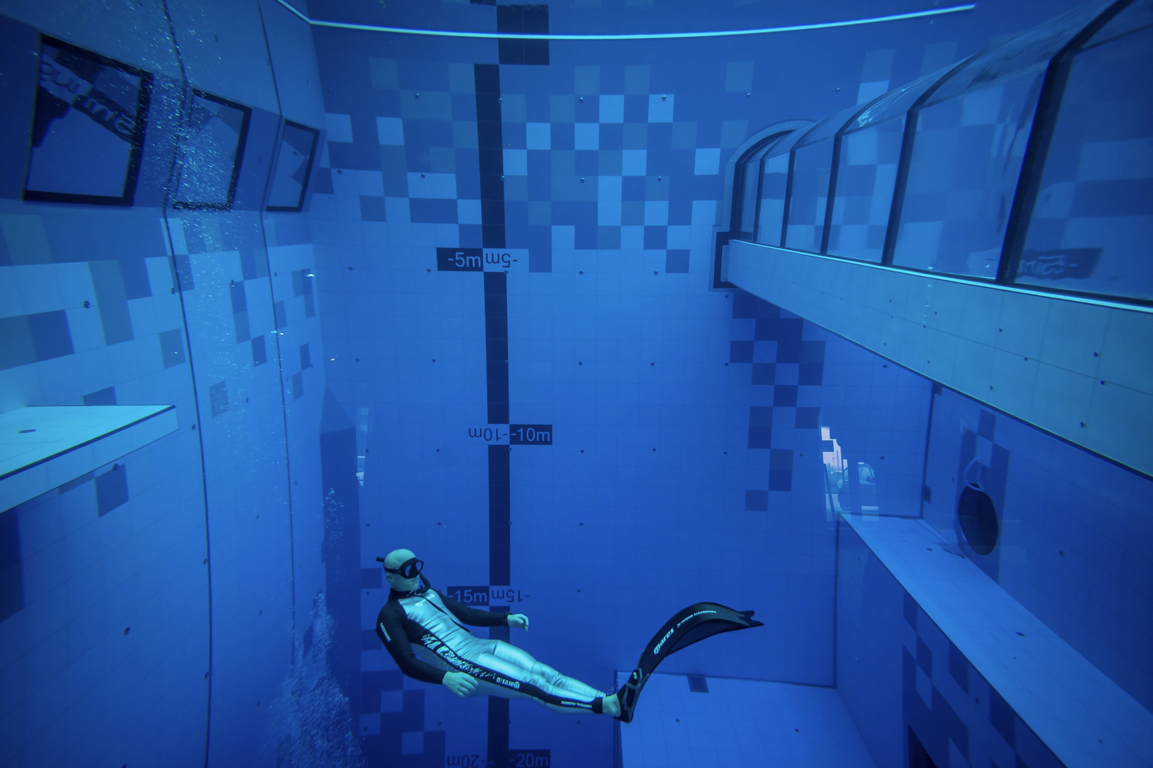 A diver is seen in the deepest pool in the world with 45.5-metre (150-foot)