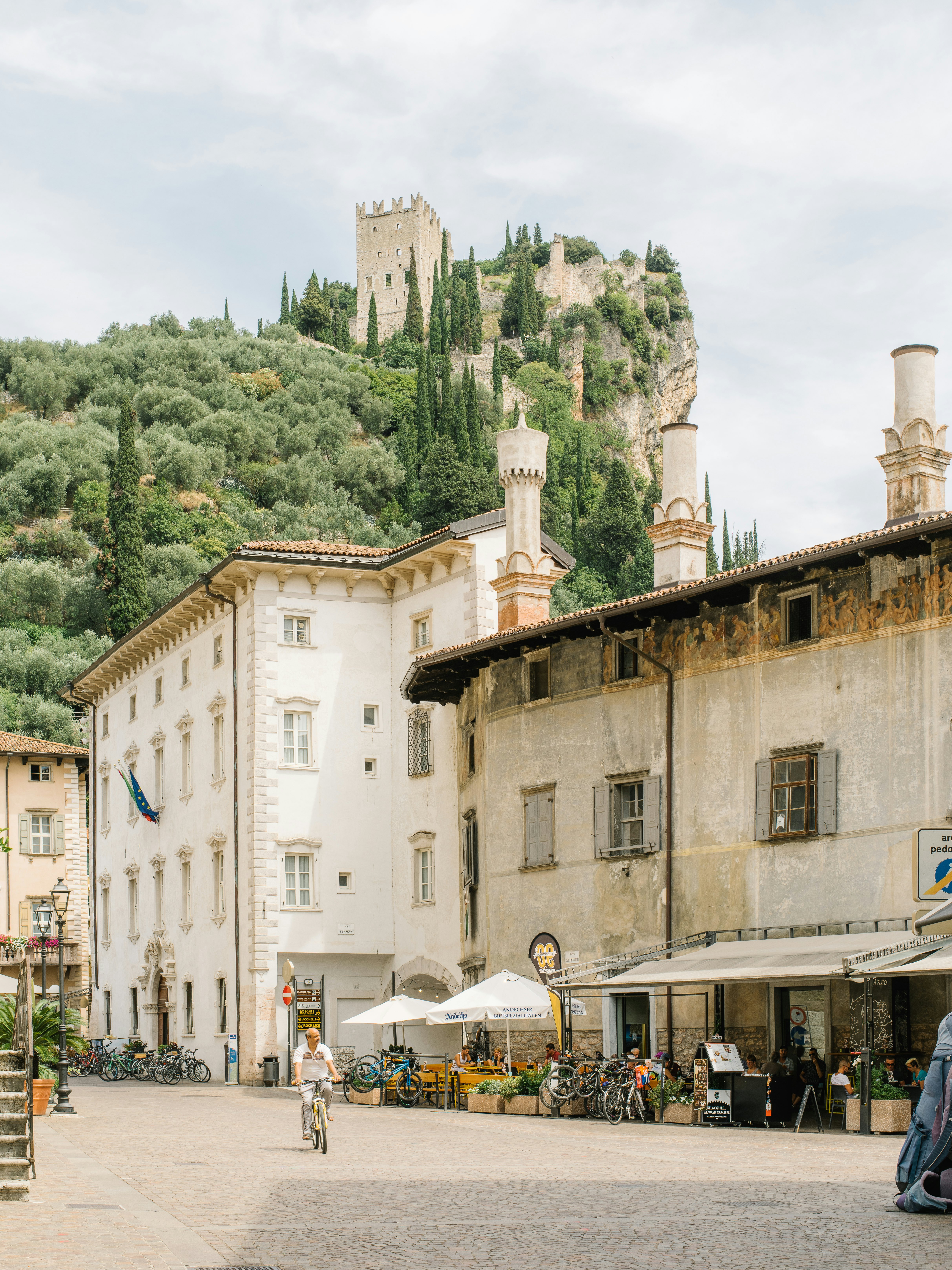 A castle perched high on a hiltop above a town