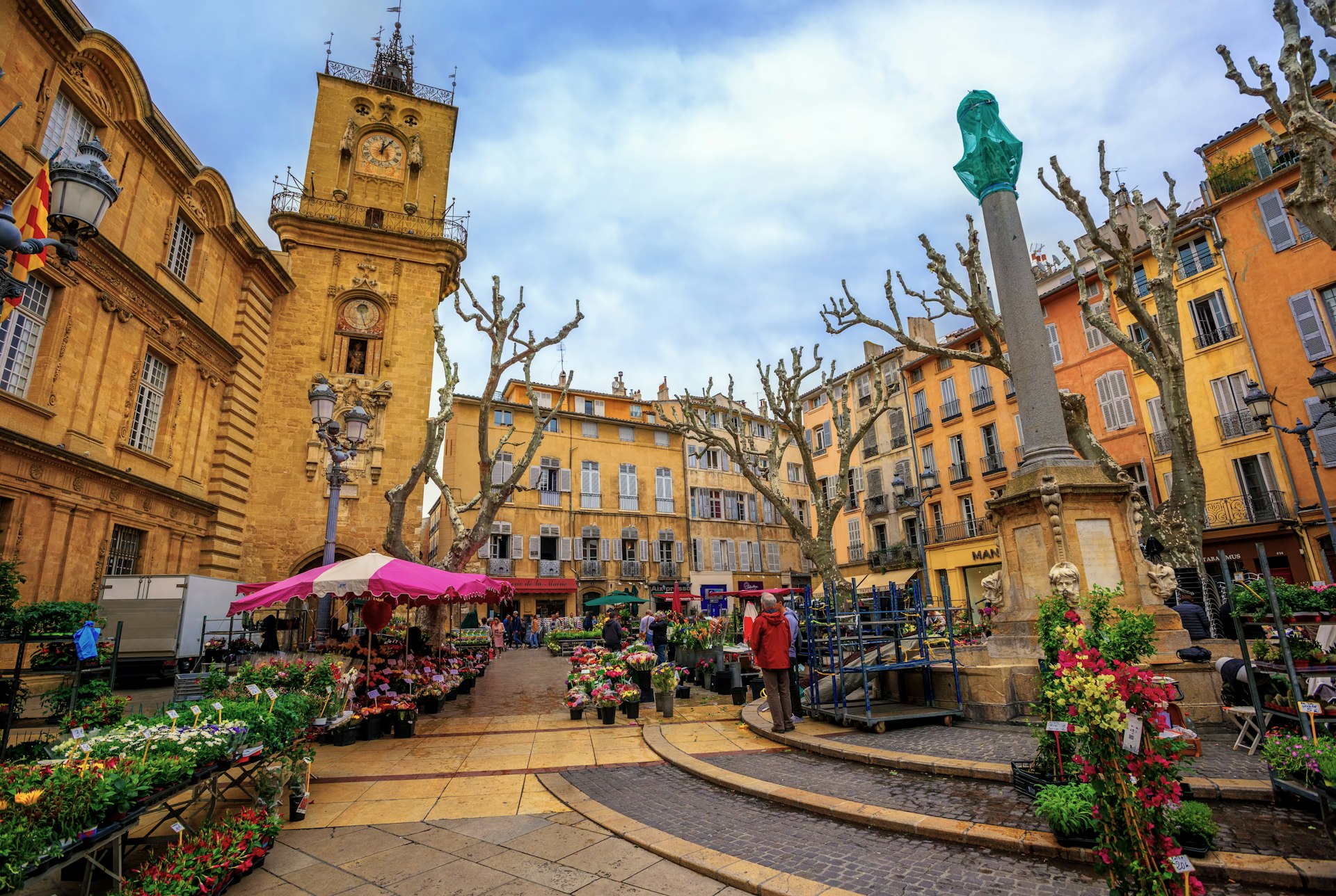 People wander through the traditional flower market in the Old Town of Aix.