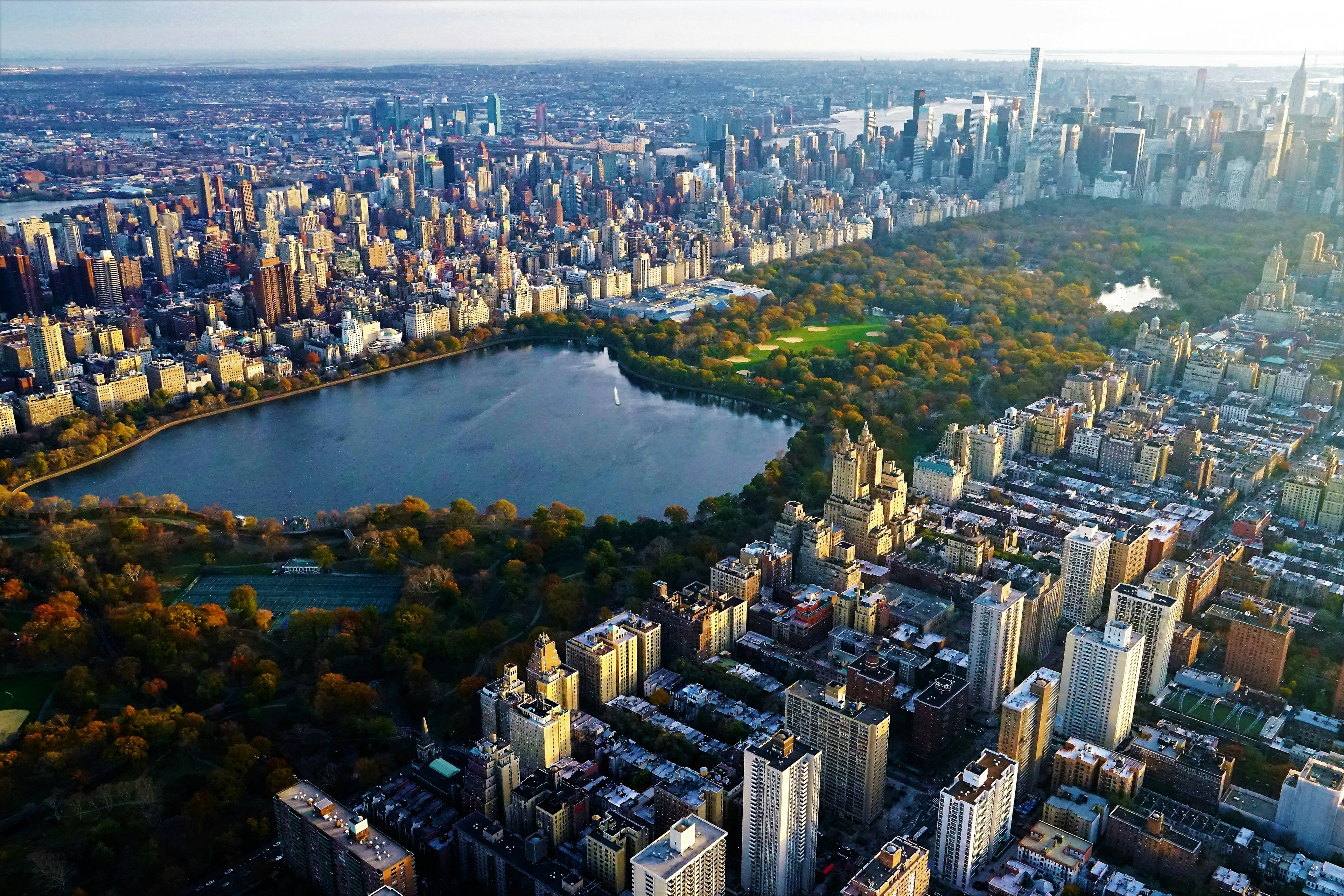 Aerial view of Central Park in Manhattan with the reservoir in foreground. You can spot the iconic Guggenheim Museum on the opposite side of the reservoir.