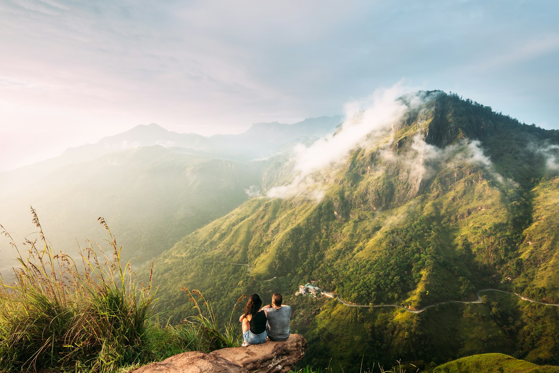 A couple admire the view from a lookout in Sri Lanka. 