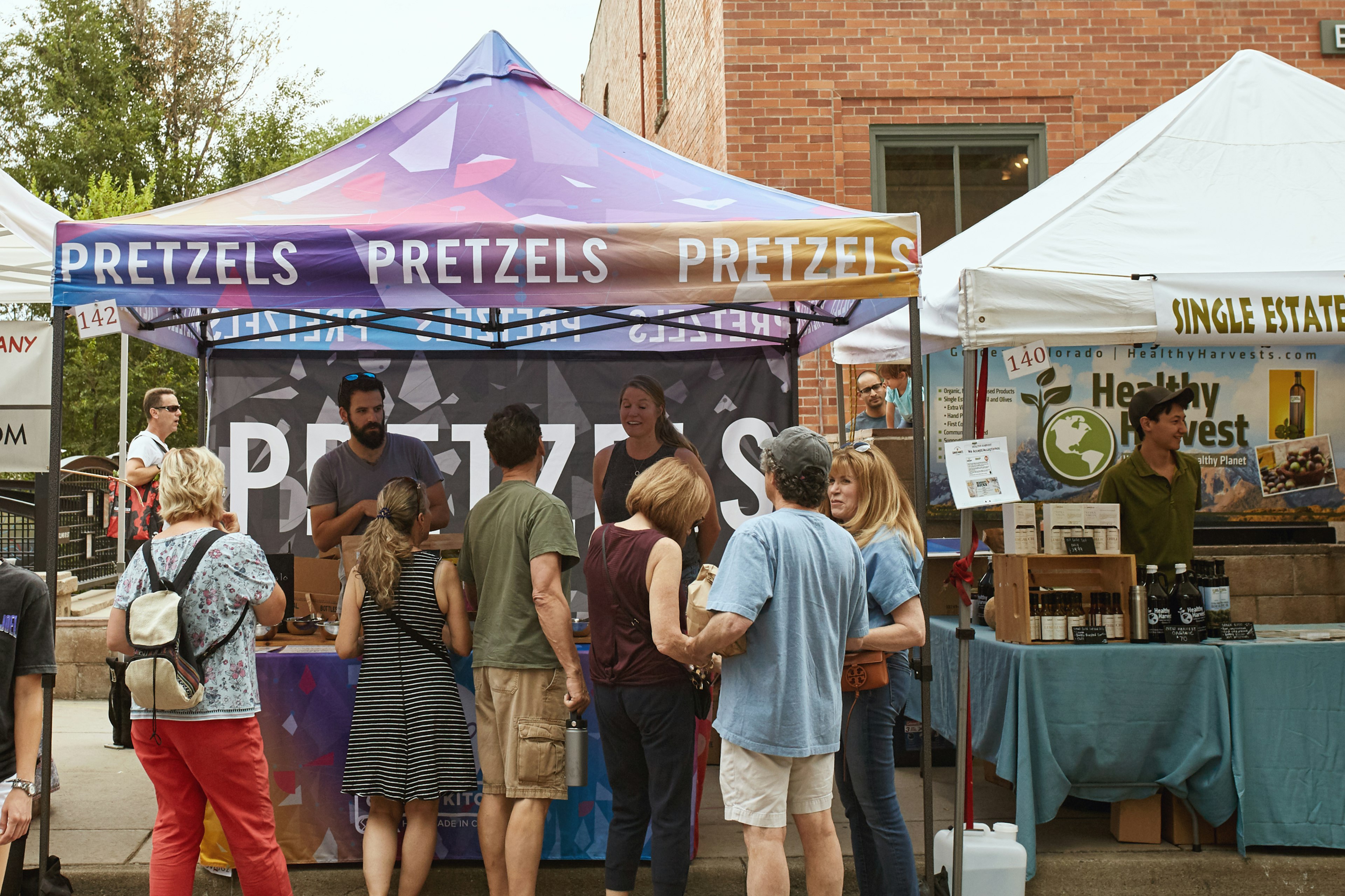 Crowds of people shopping for local goods at Boulder County Farmers Market