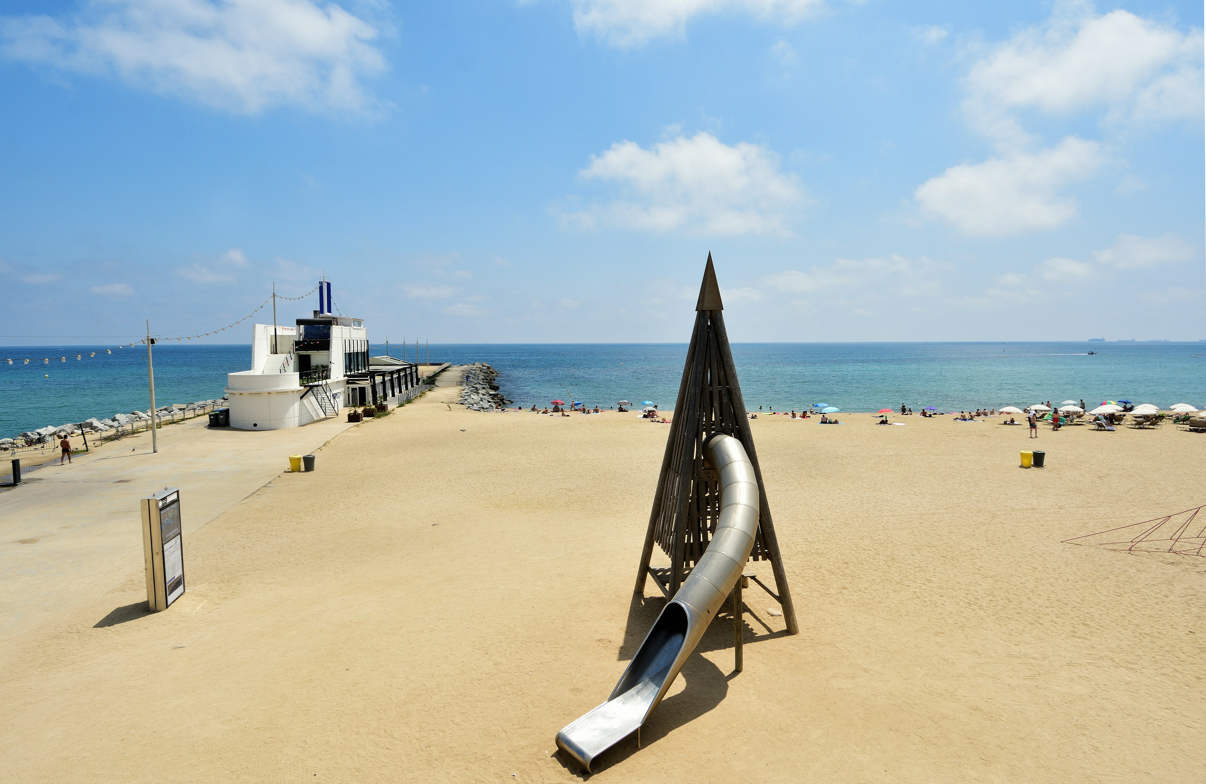 Barcelona Club Beach stands next to a children's slide on Mar Bella Beach